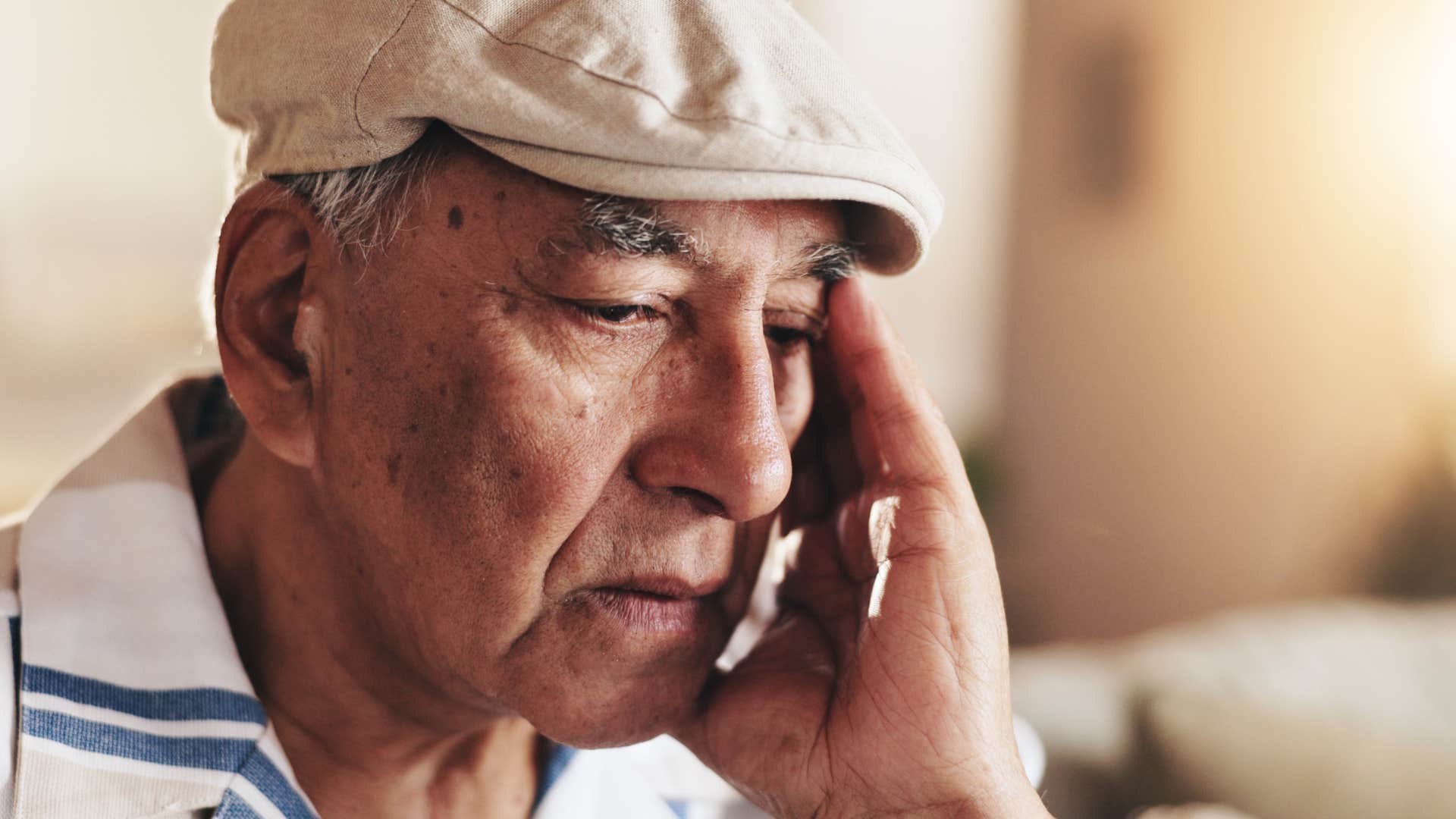 older man thinking about his own parents reminiscing 