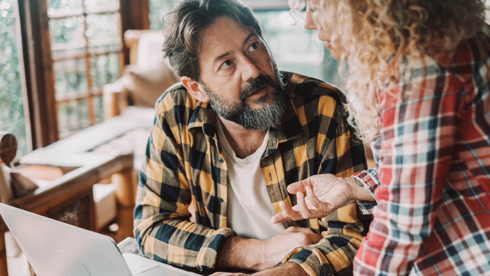 busy wan who's always working talking to his mother