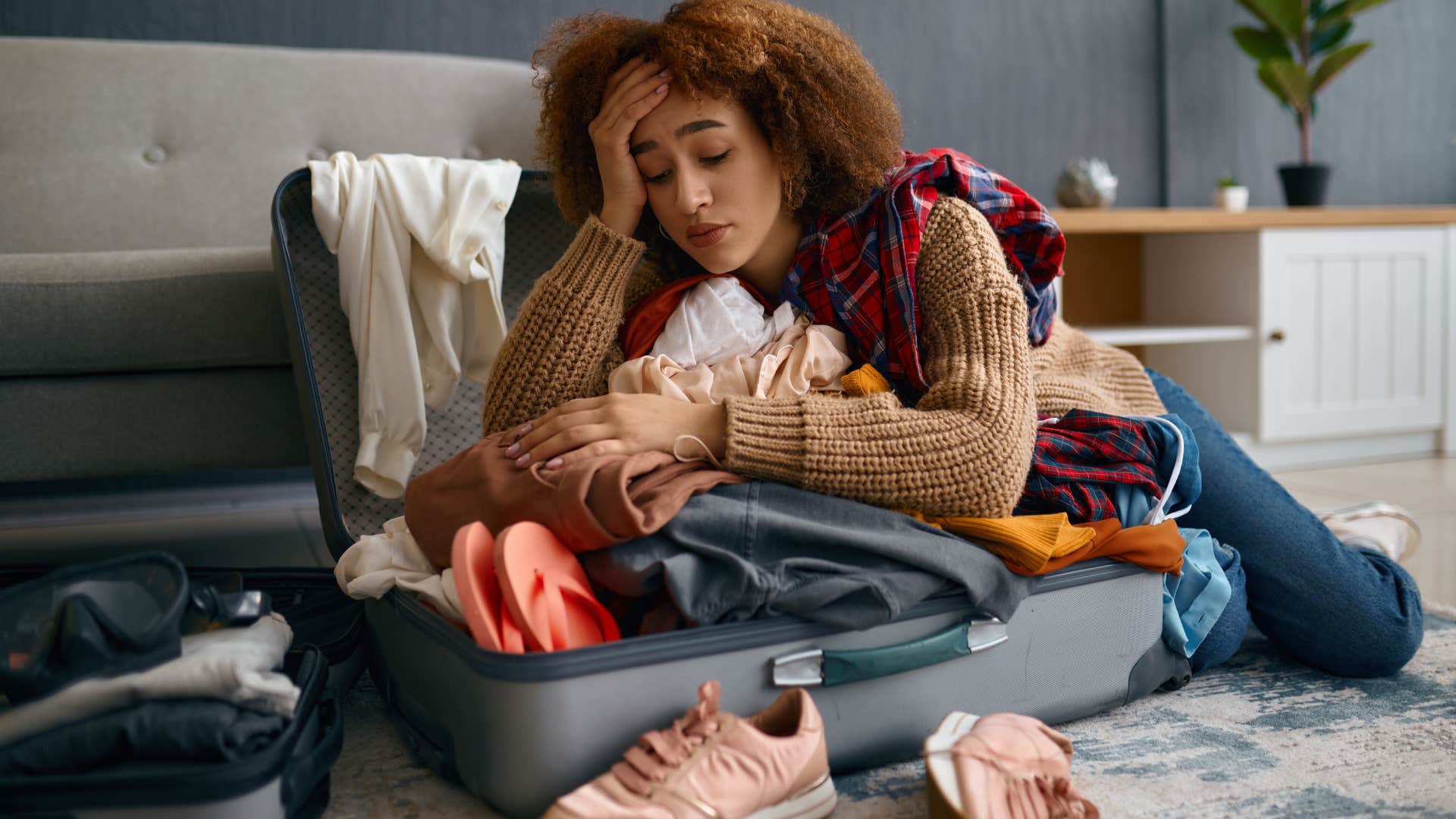 woman living out of a suitcase visiting her parents