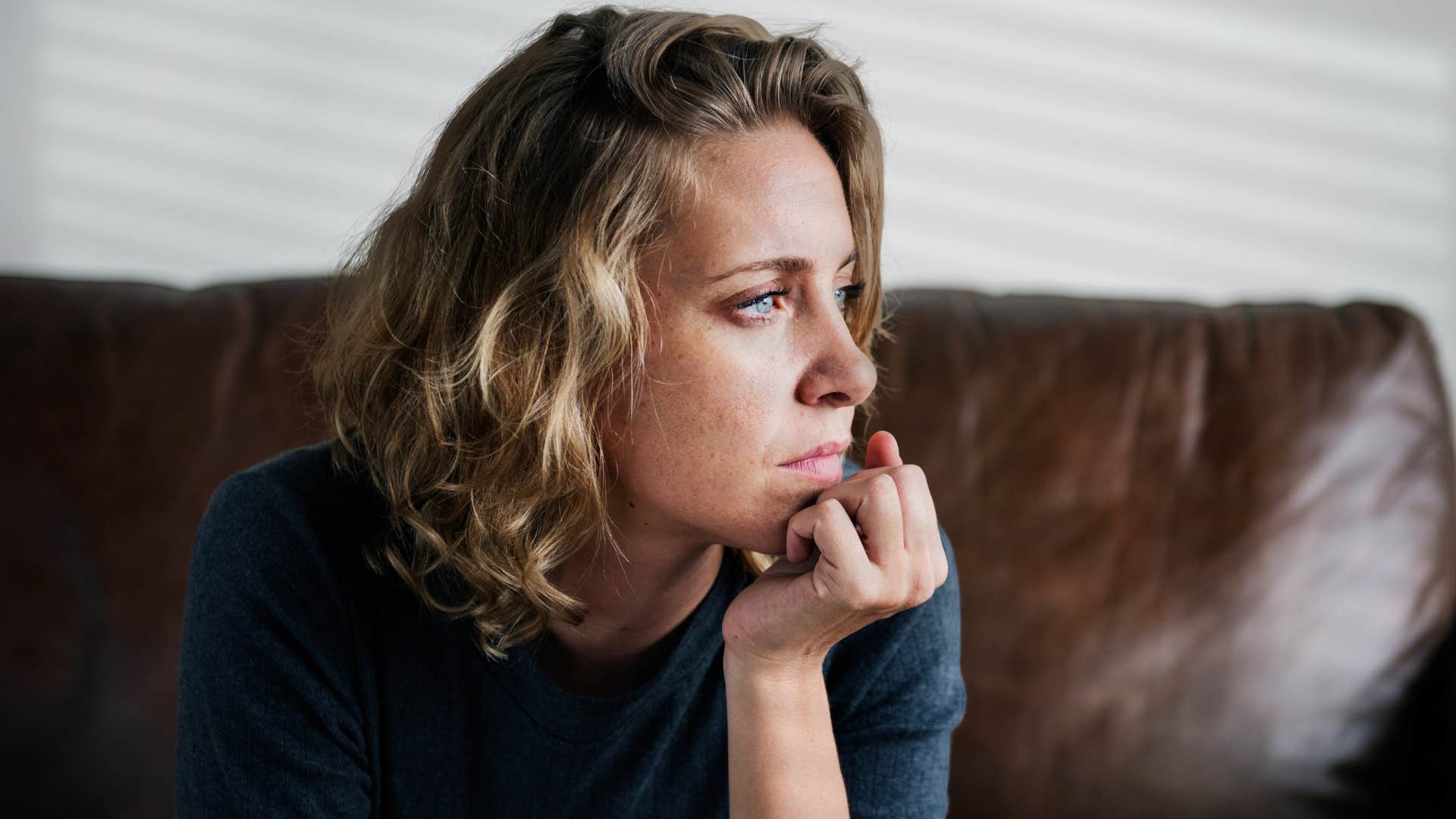 woman spending time in a separate room at her parents' house