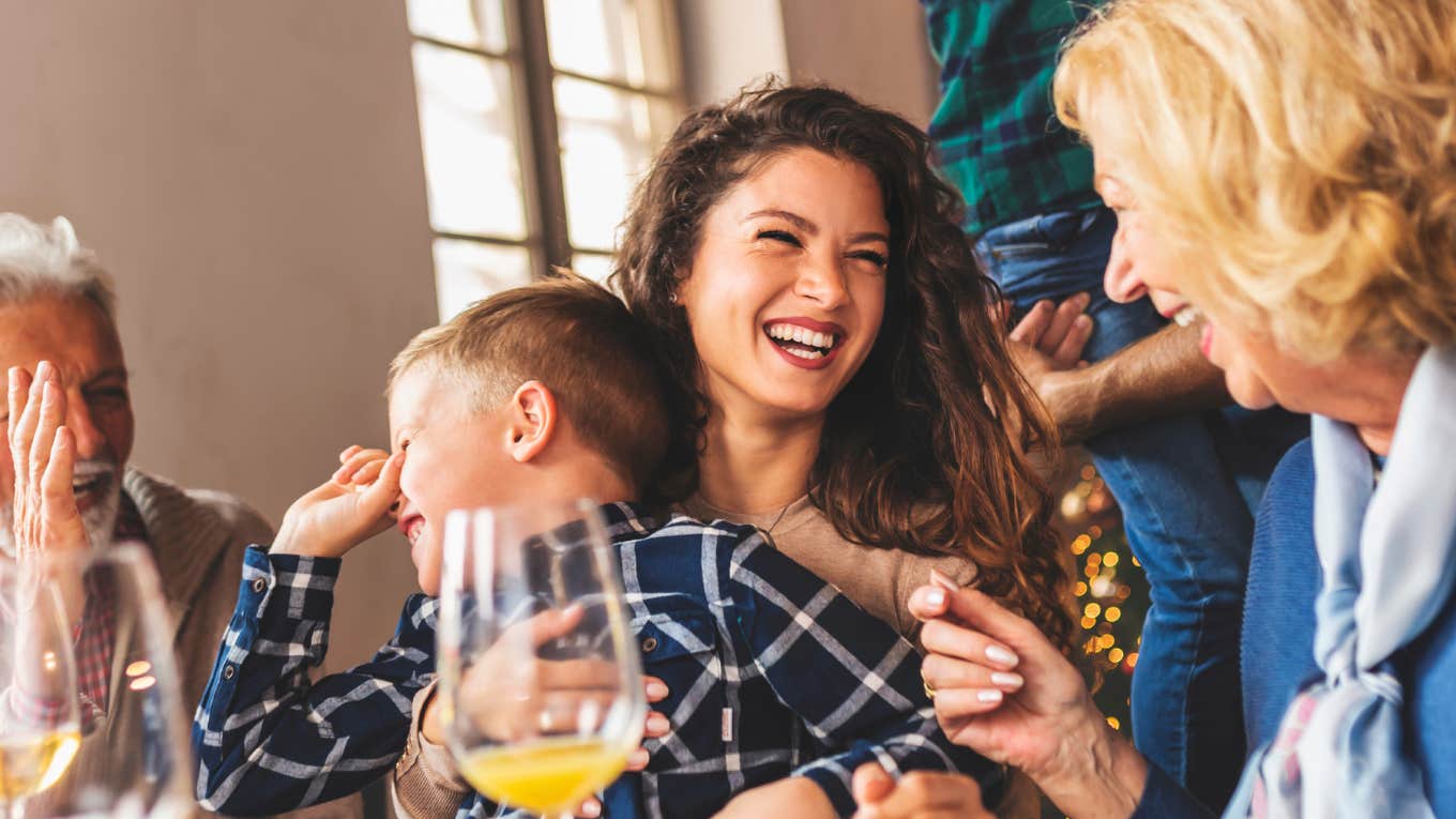 Calm happy family sharing a peaceful holiday meal showing the art of peaceful holiday dinners and how drama-free families keep the peace.