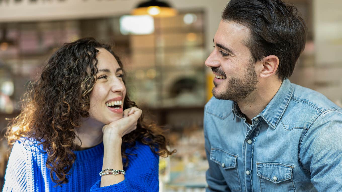 man and woman looking at each other with deep attraction