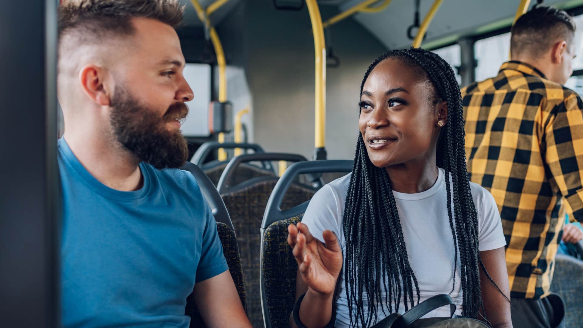 strangers attracted to each other talking on the bus