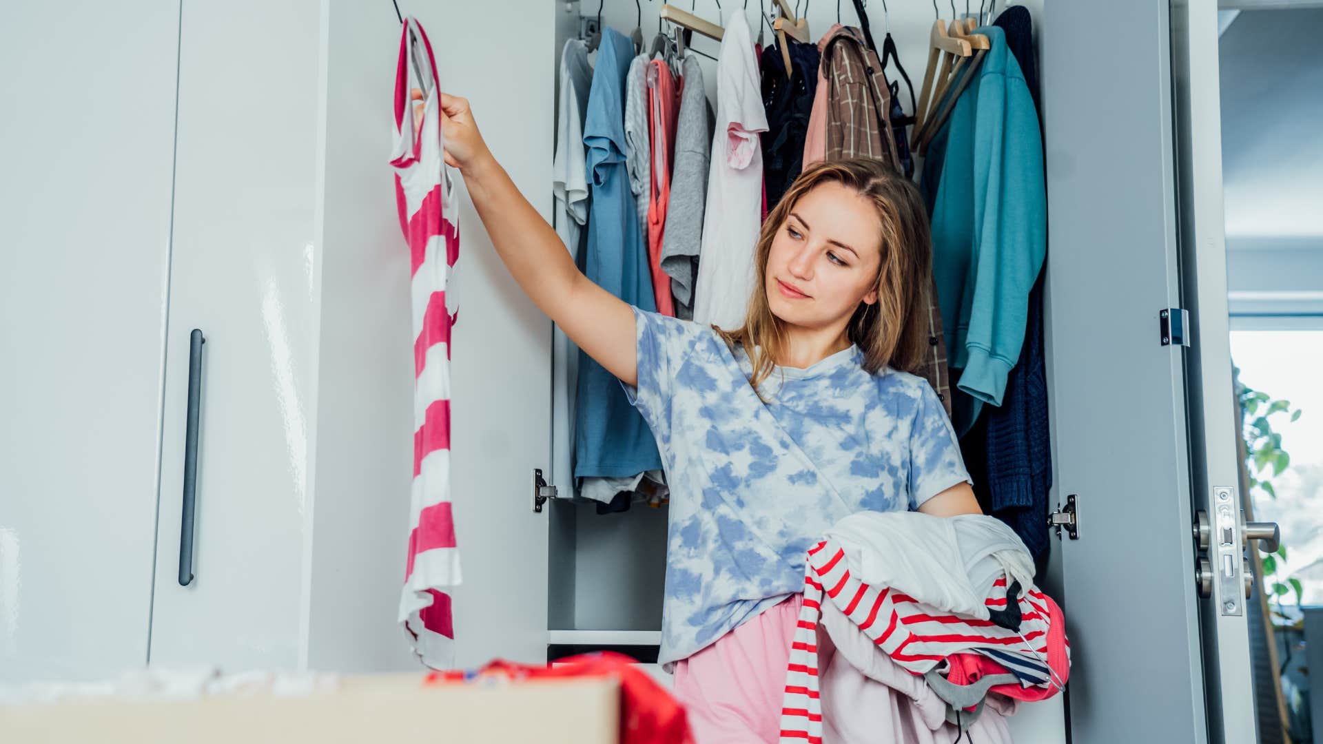 woman organizing closet