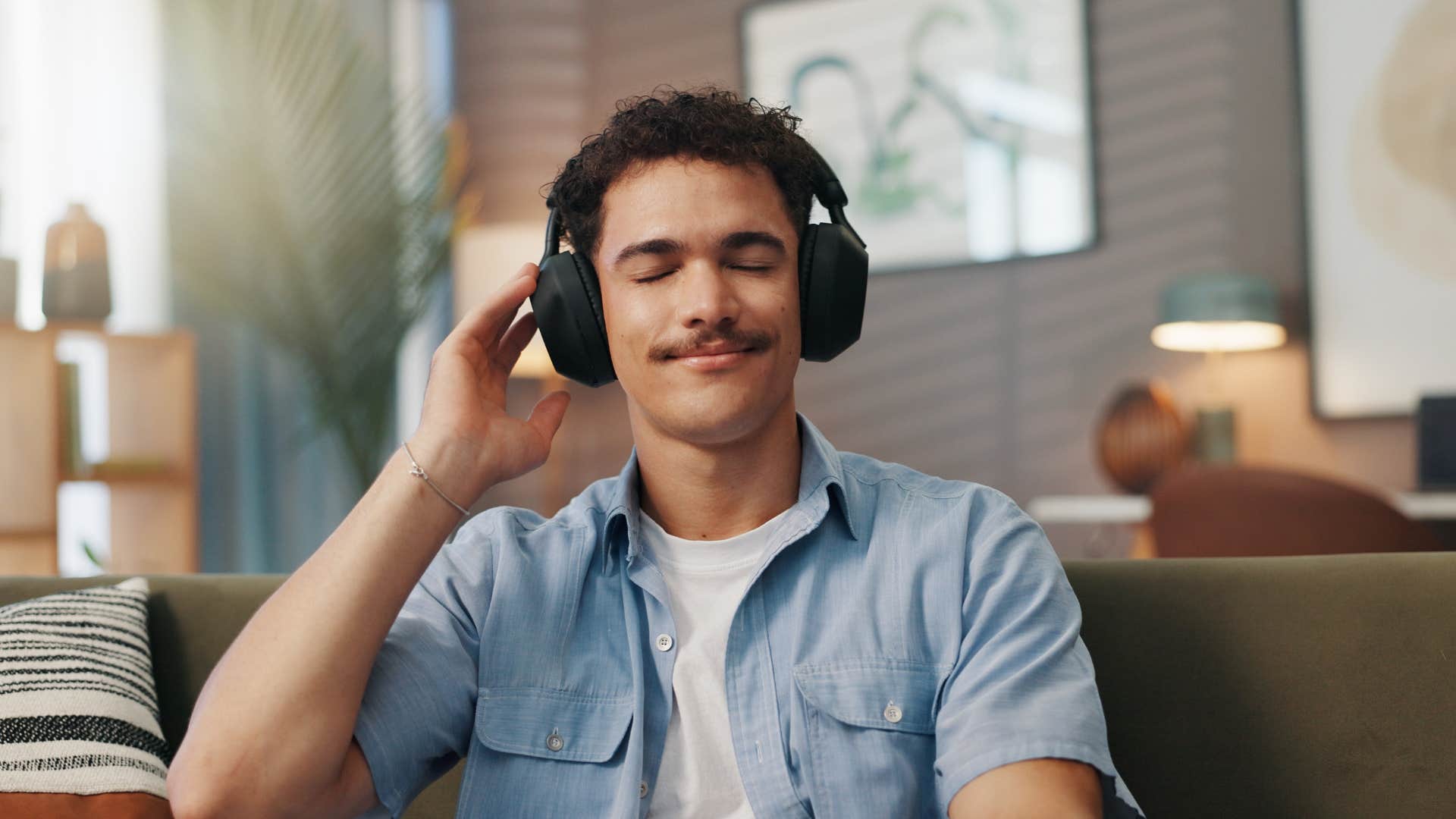 man wearing headphones relaxing