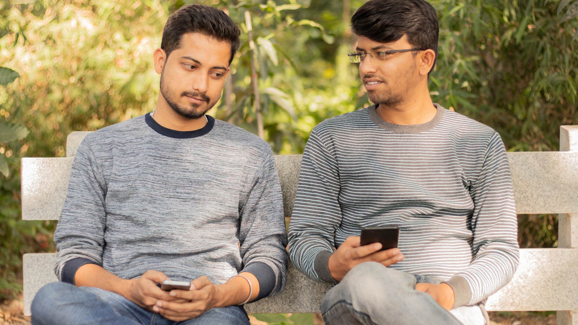 man struggling with social interaction sitting next to acquaintance