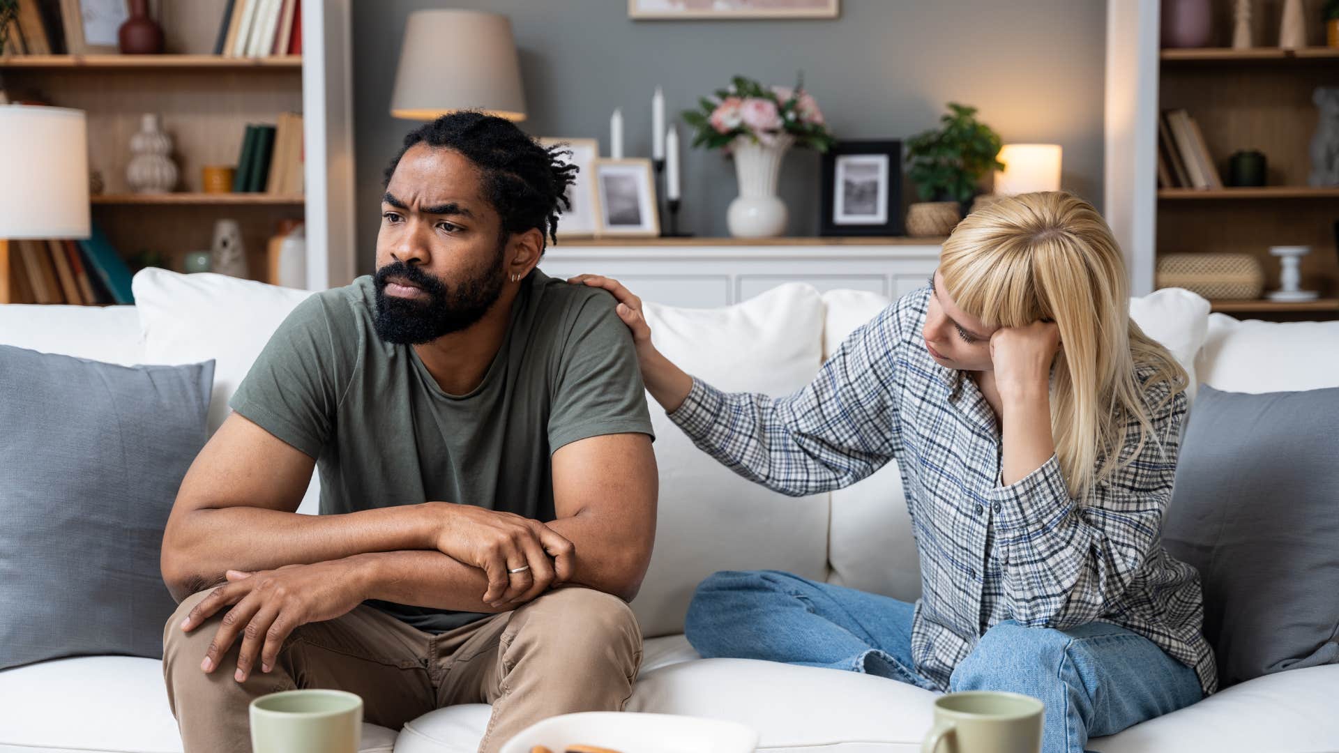 man uncomfortable with intimacy turned away from partner