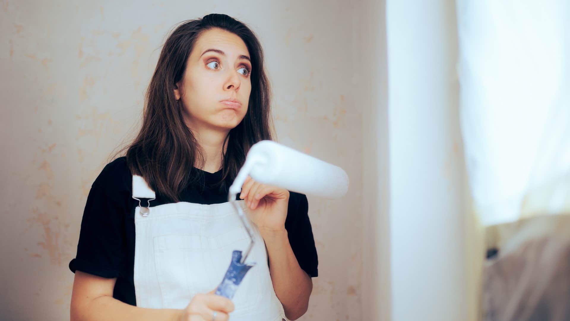 woman painting feeling overwhelmed