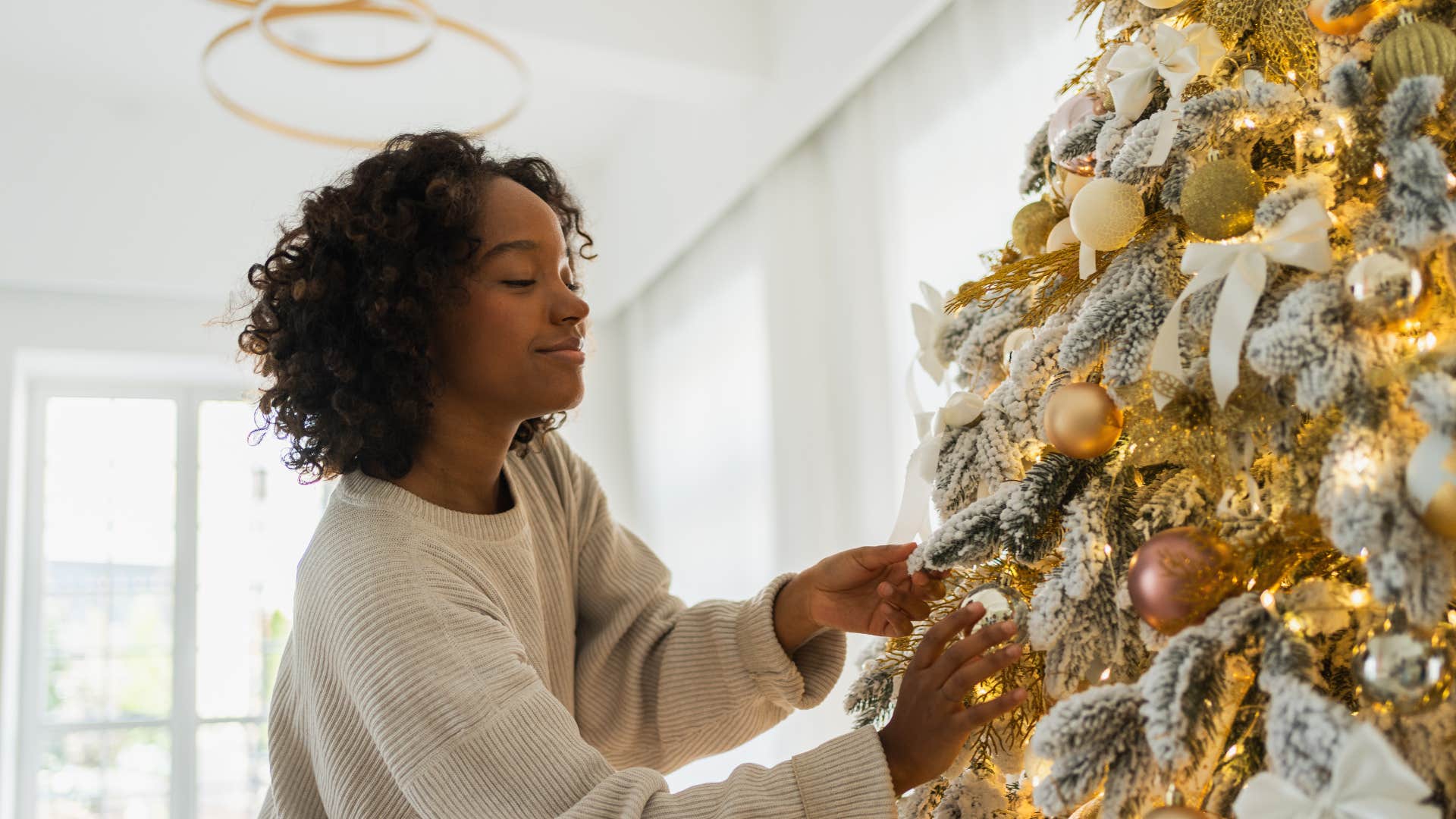 woman decorating christmas tree to tell a story