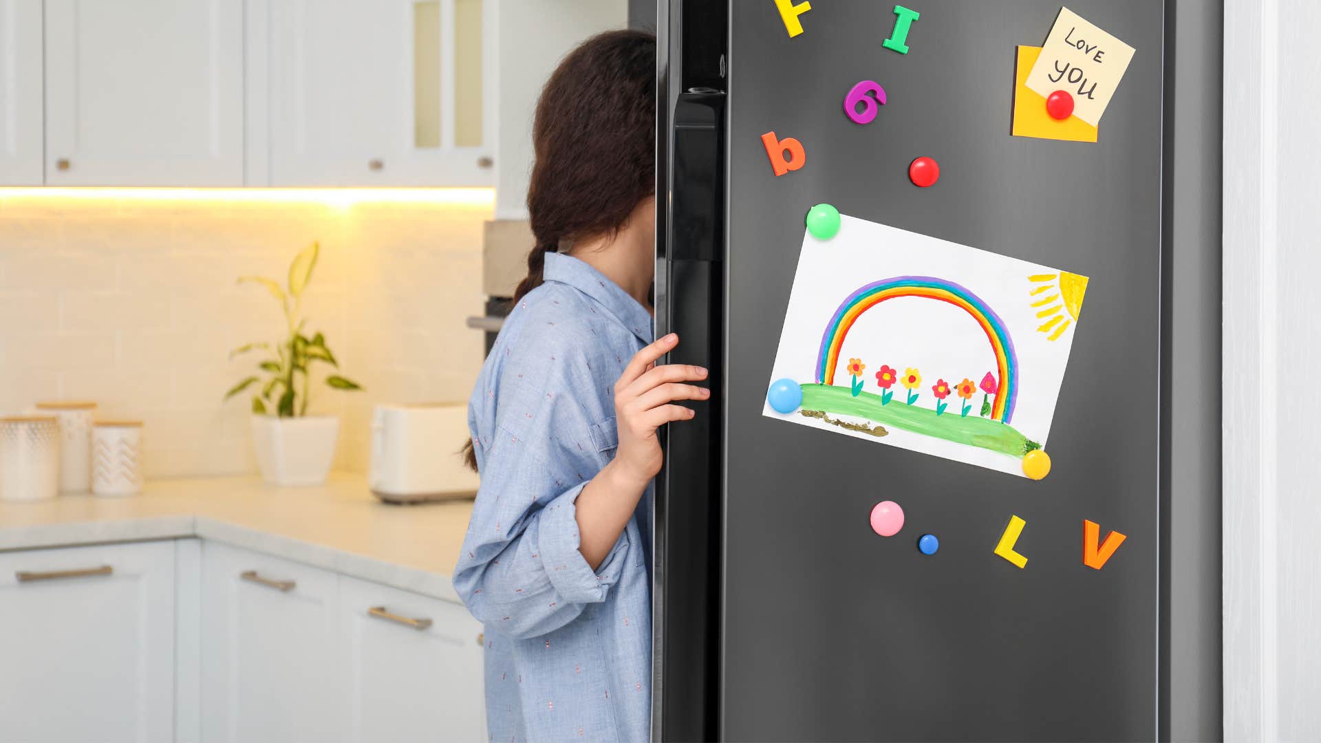 woman looking in fridge valuing function over fashion