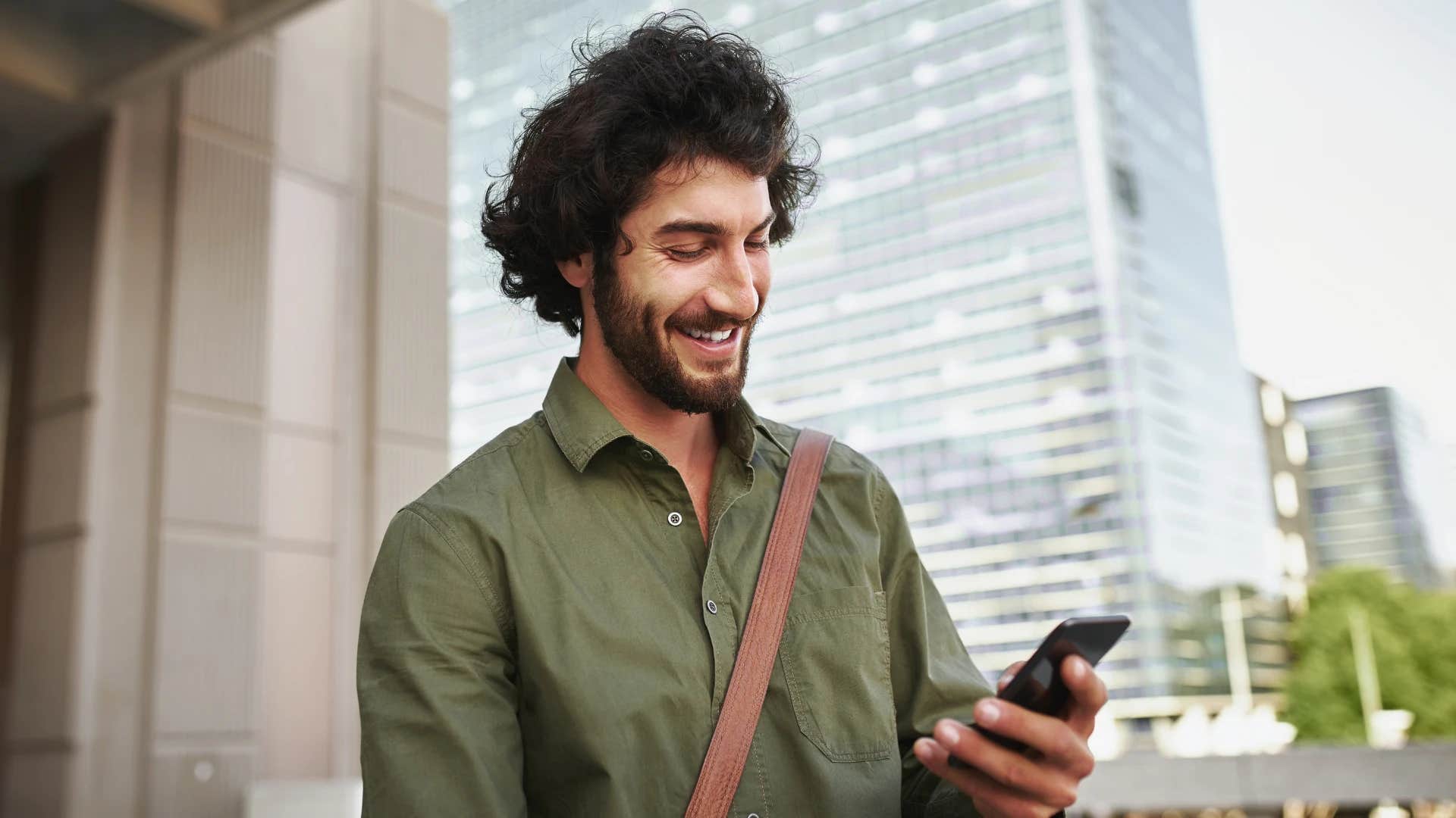 man seeing validation on social media through his phone