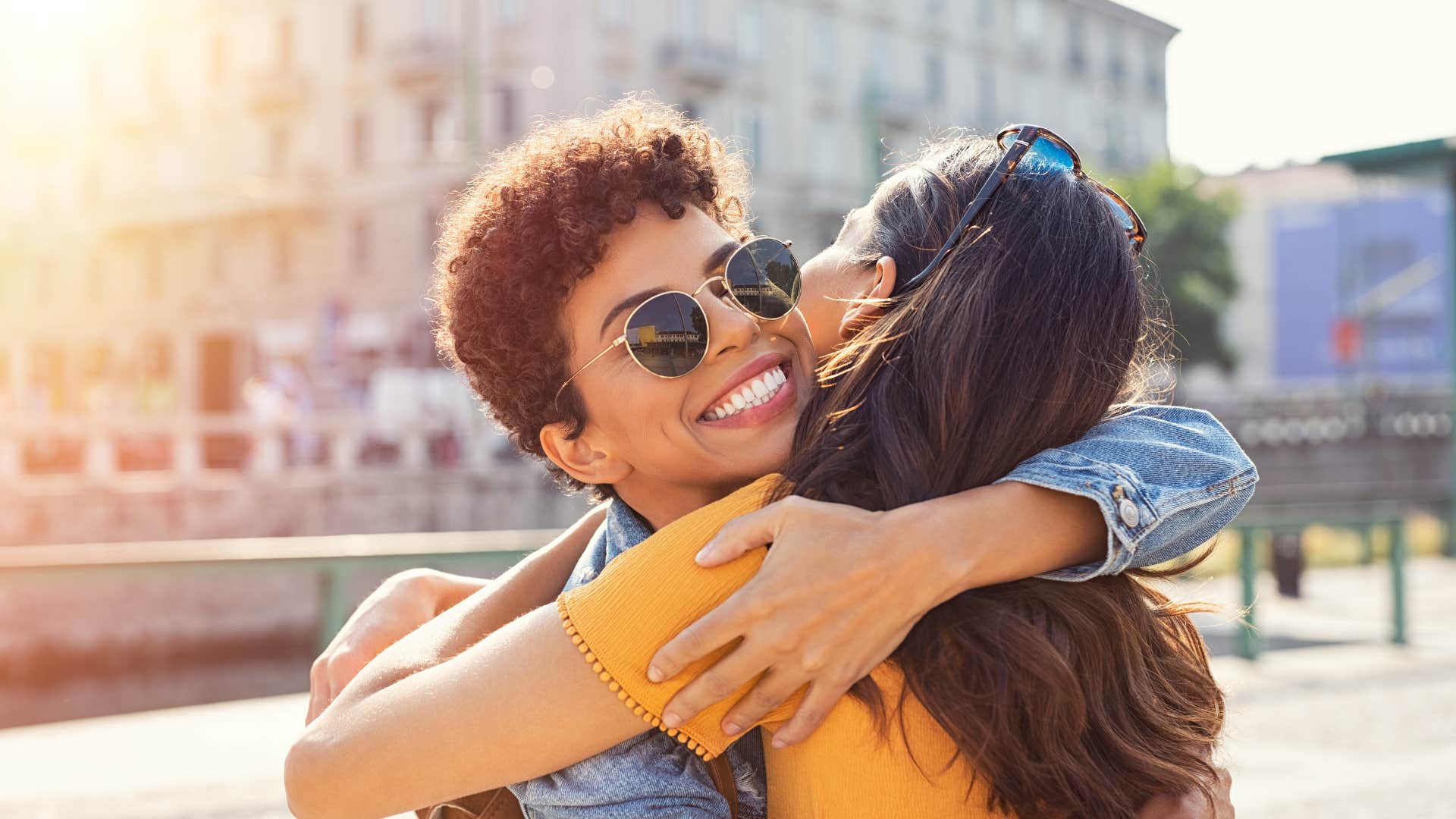 outgoing friends hugging one another