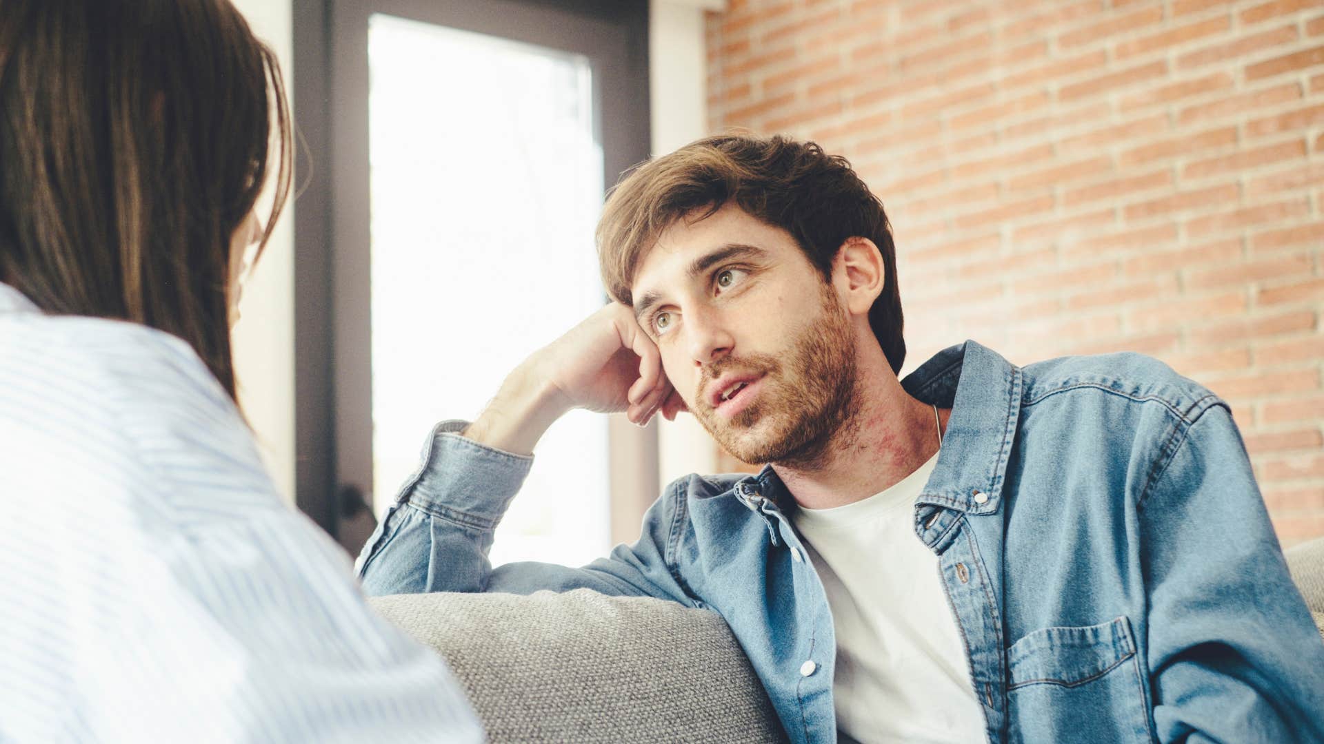 man listening to woman as he noticed his partner needed an emotional check in