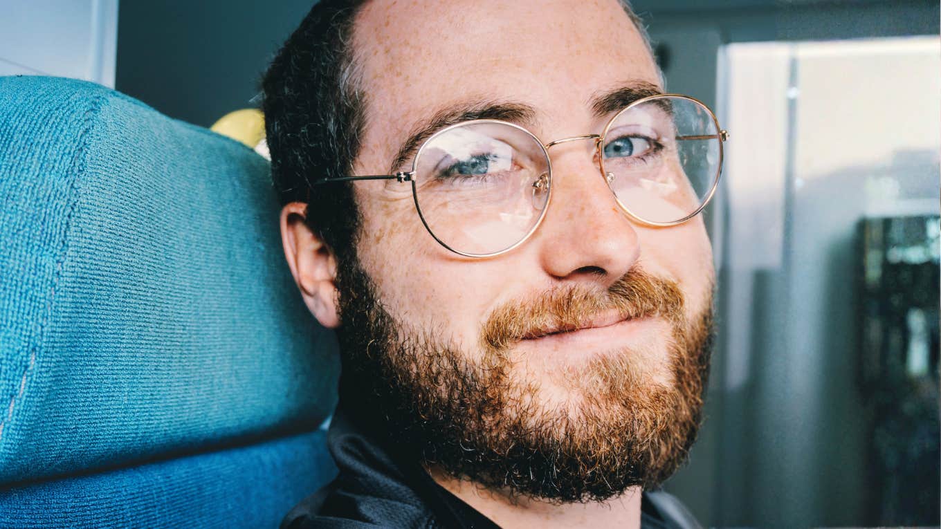 kind calm person offering supportive eye contact, representing personality traits linked to emotional safety and low risk of hurtful behavior.