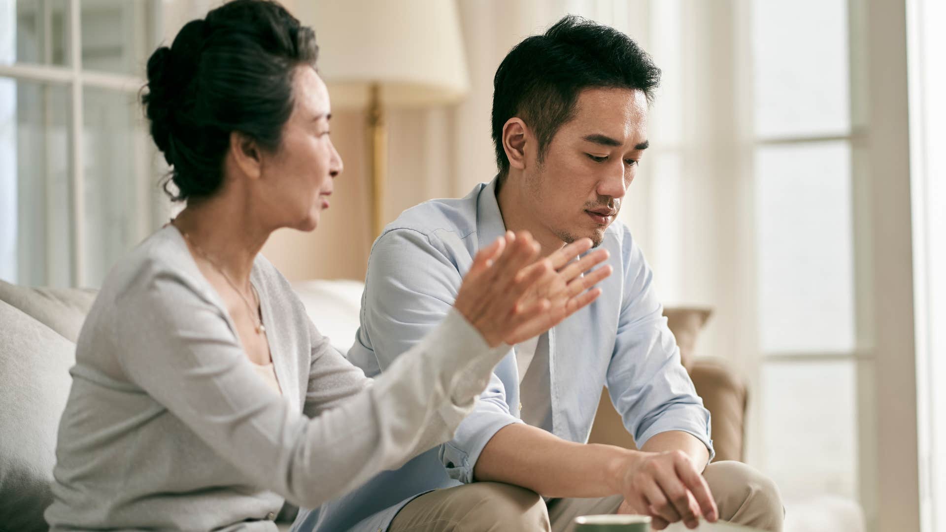 serious man telling concerned mom you don't need to worry about me