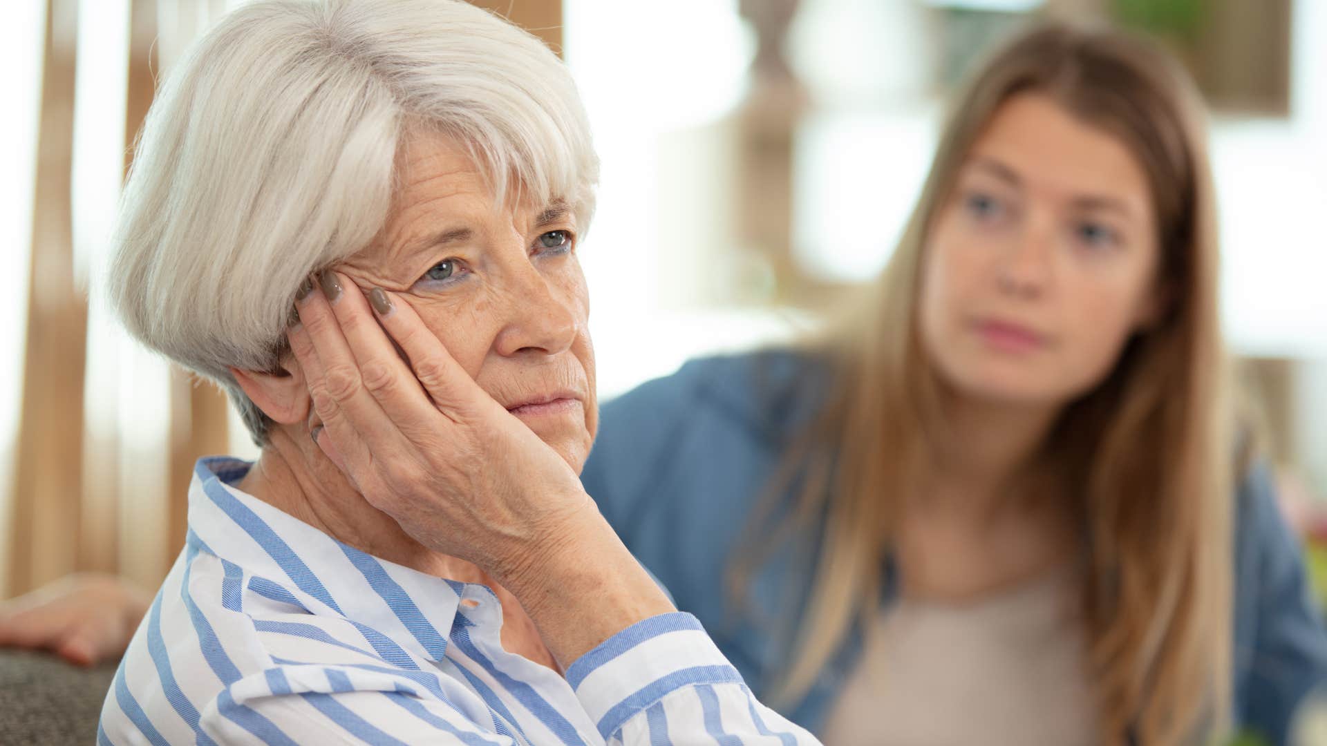 older woman sad by daughter telling her I don't actually need your permission