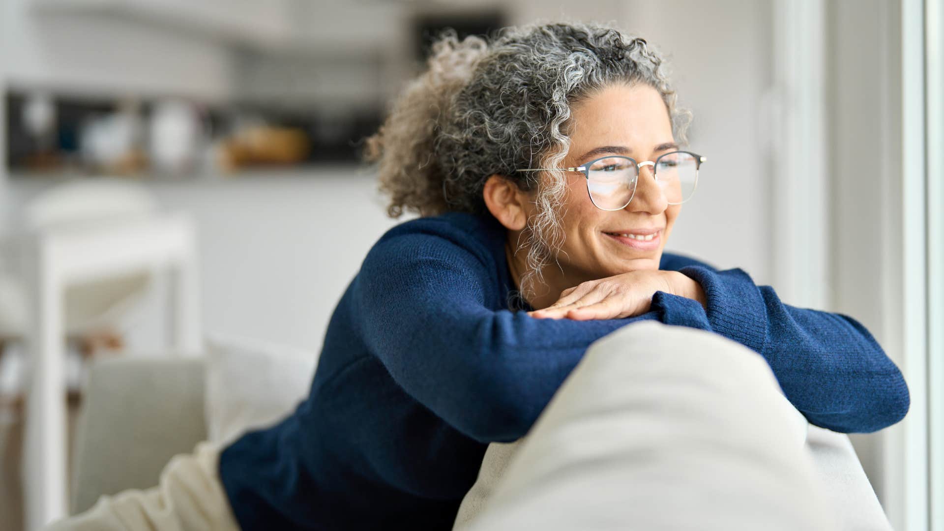 Woman who's an introverted intuitive smiling at home.