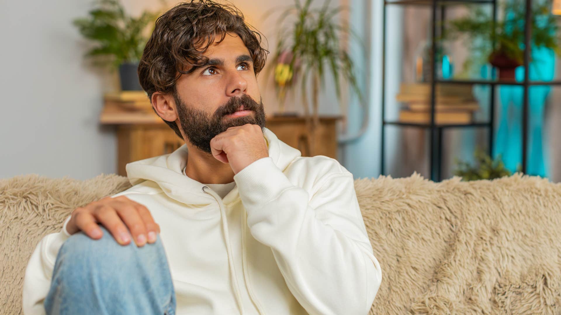 Man who's naturally nostalgic sitting at home.