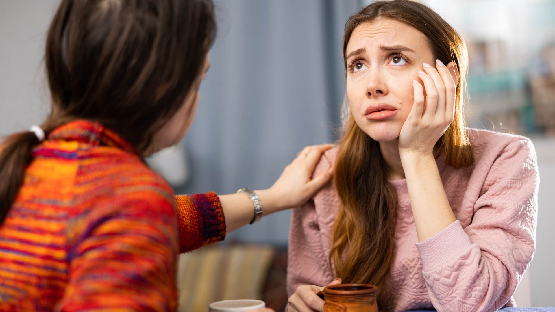 Woman saying "you don't have to be strong here" to an upset friend.