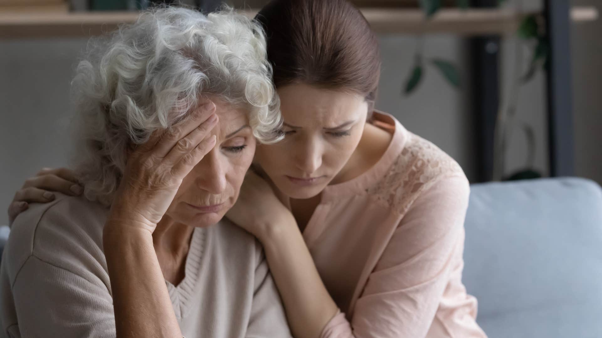 Woman saying "Would it help if I just sat here with you?" to her upset mom.