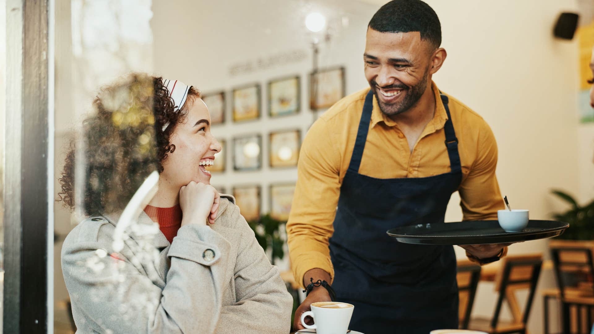 Woman saying "take your time" to a service worker.