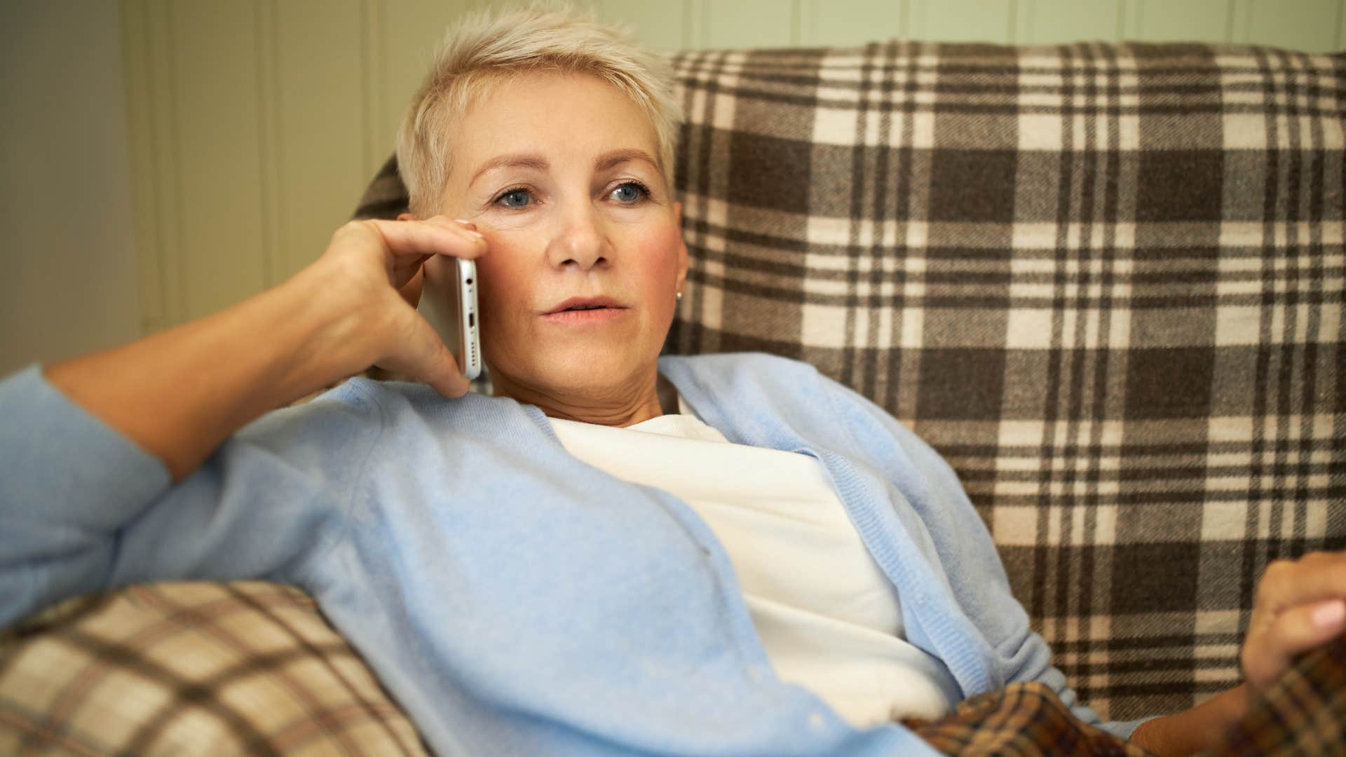 Woman saying "you're not too much" on the phone.