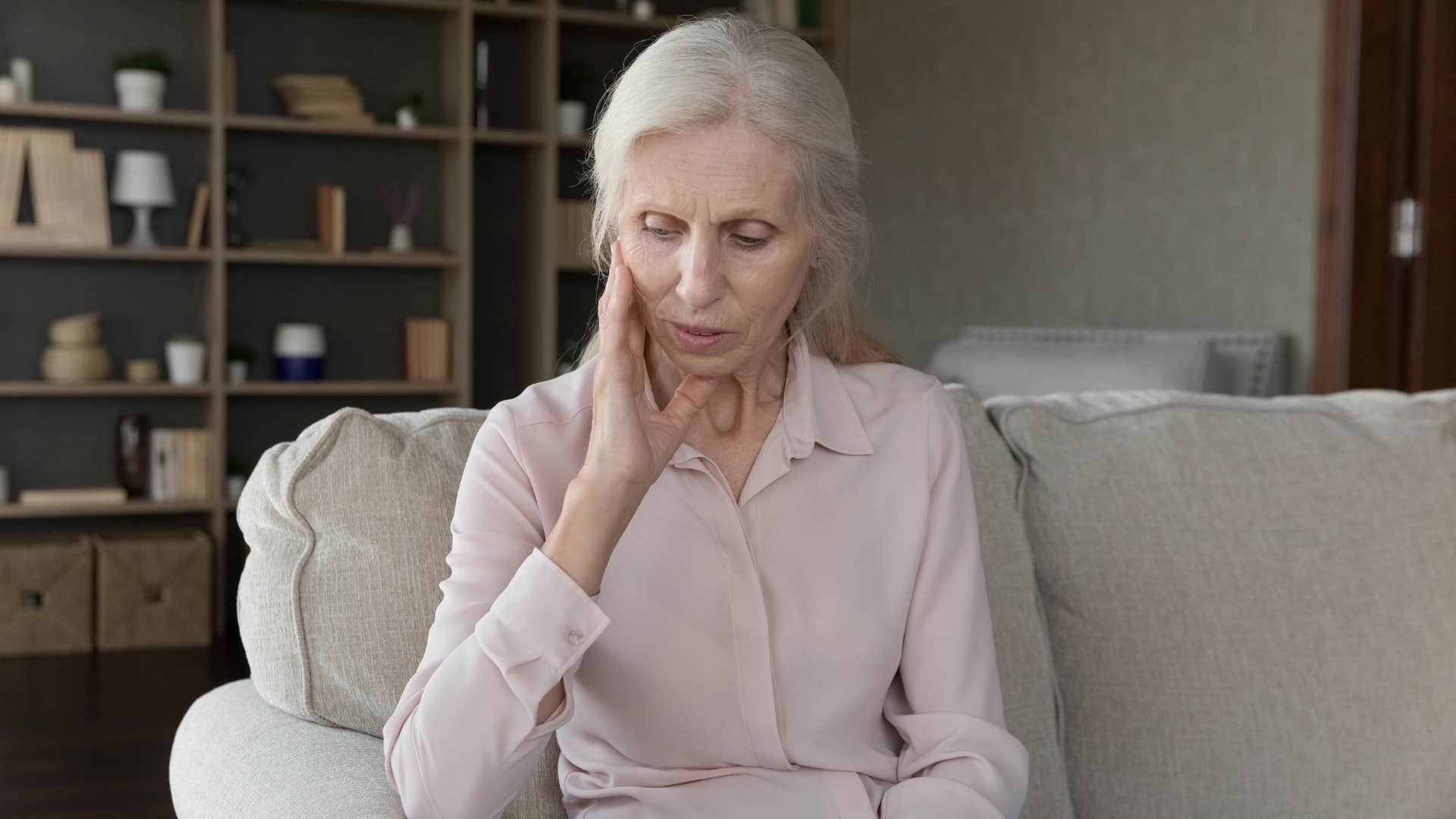 older woman feeling guilty