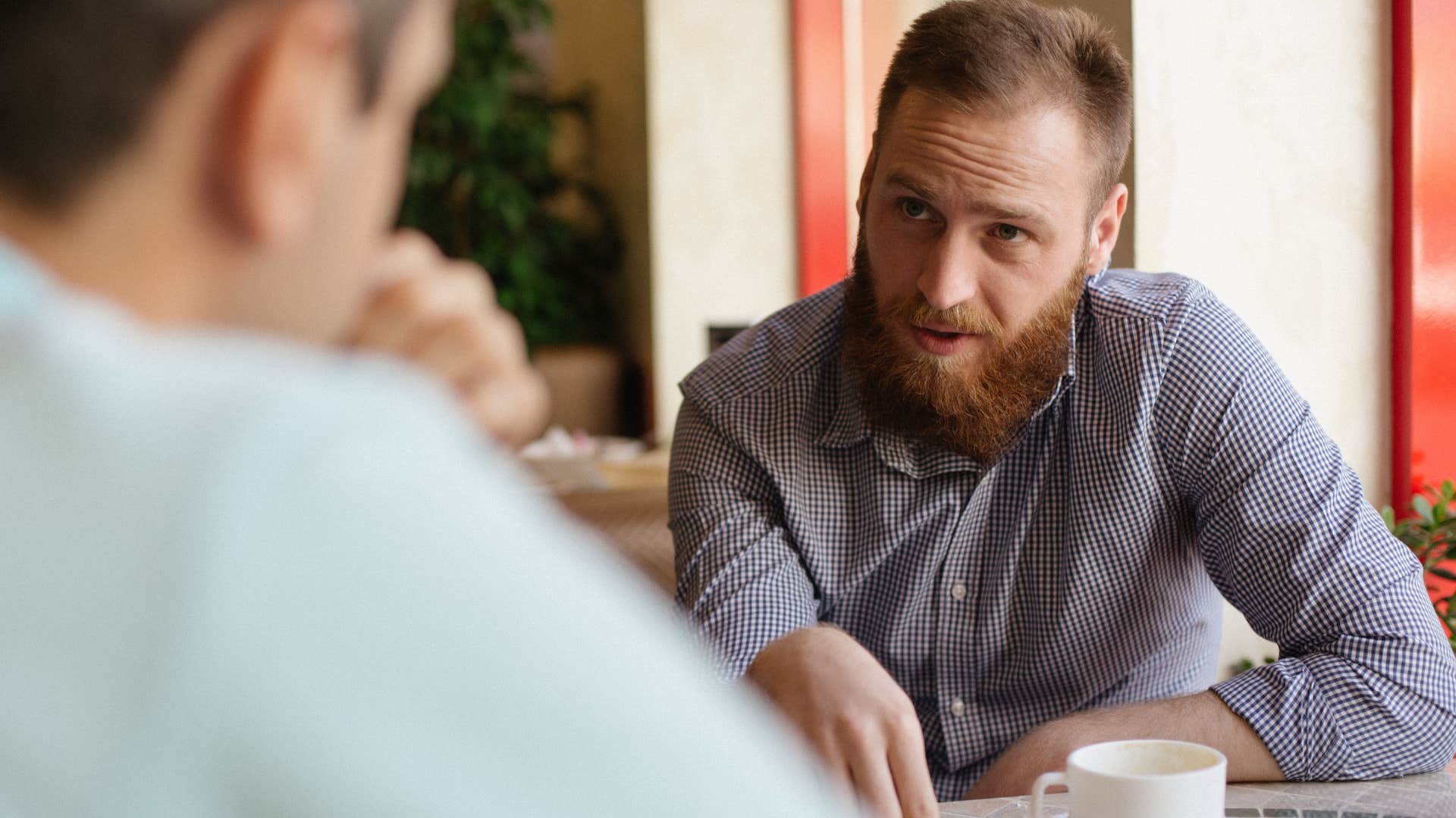rude man saying it's not my problem to his friend