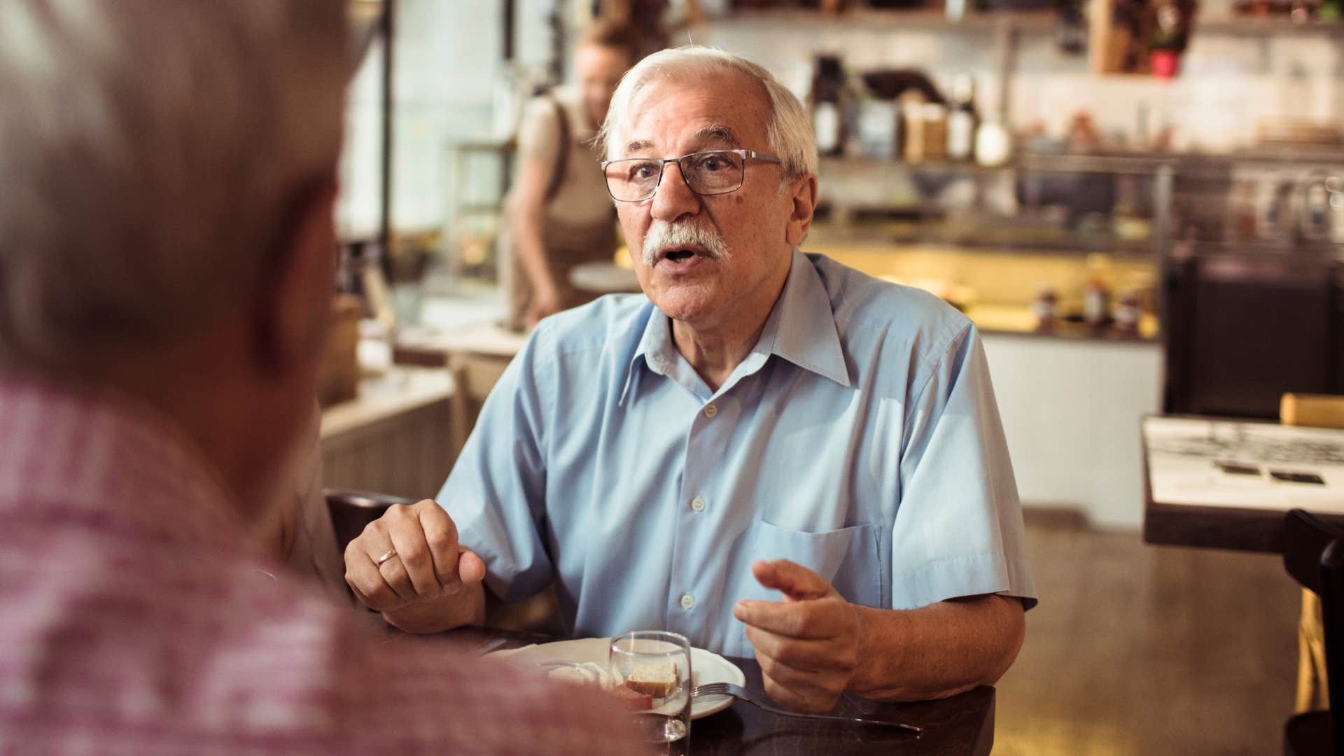 vengeful older man saying they had it coming to partner in public