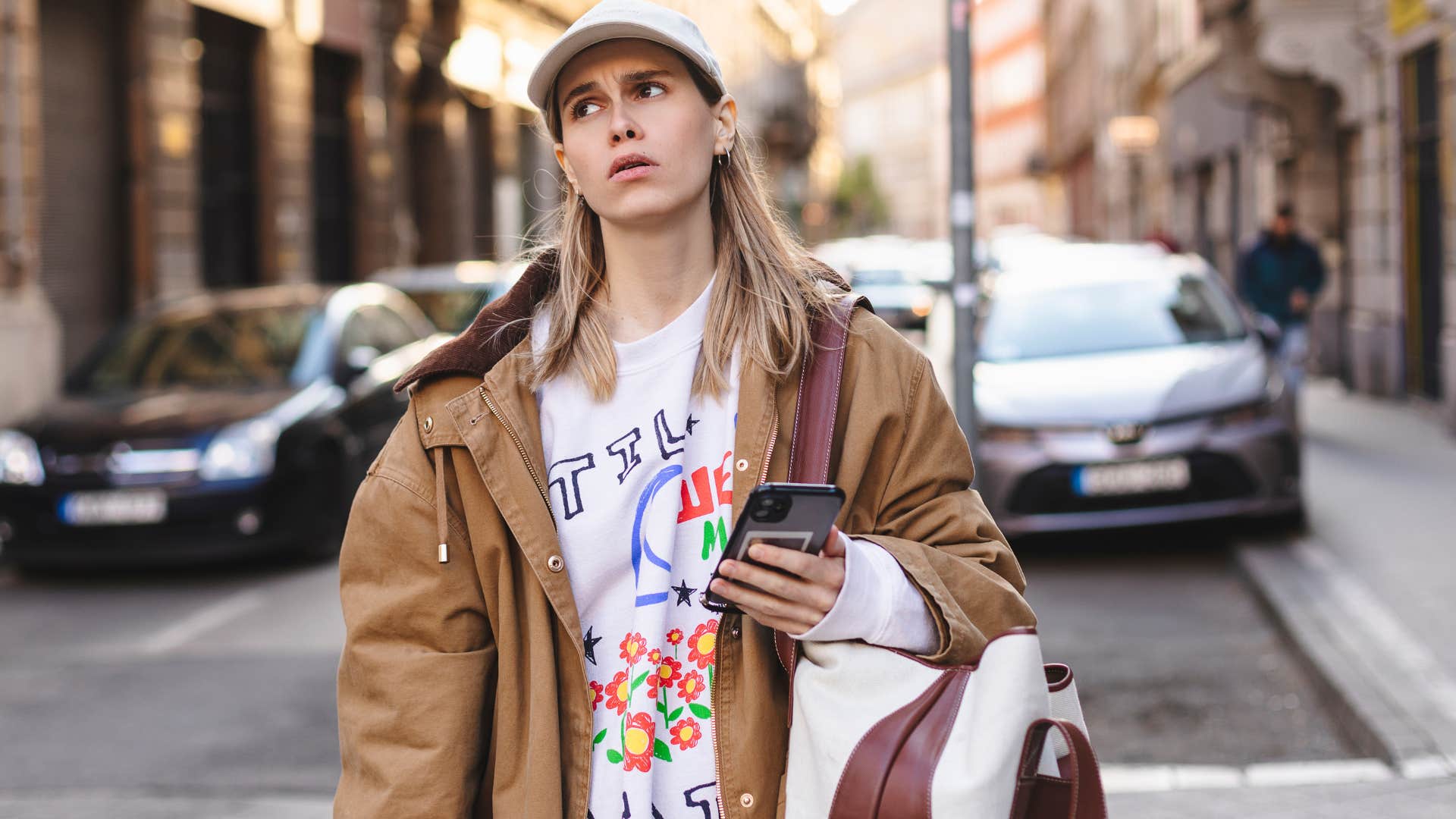 woman who's in a rush looking annoyed outside