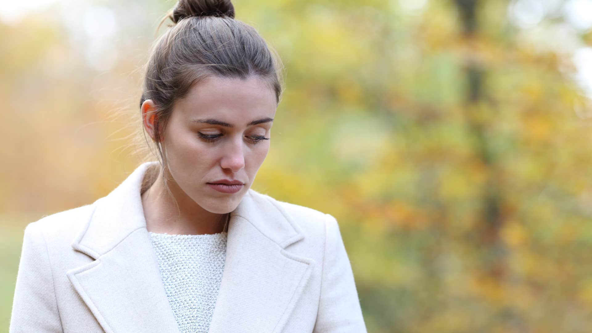 woman trying to move more standing in the forest
