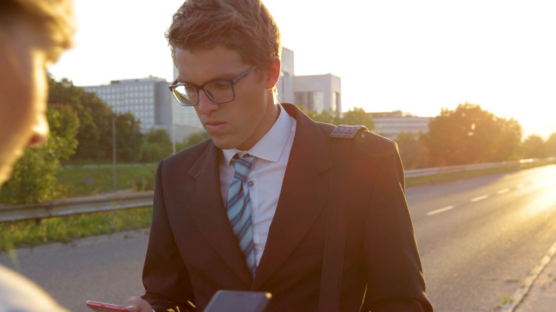 quick thinking man walking with friend outside