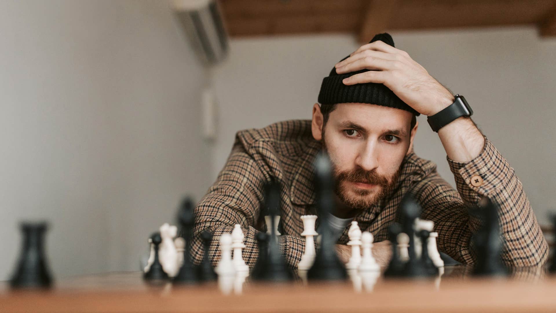 man solving a problem playing chess