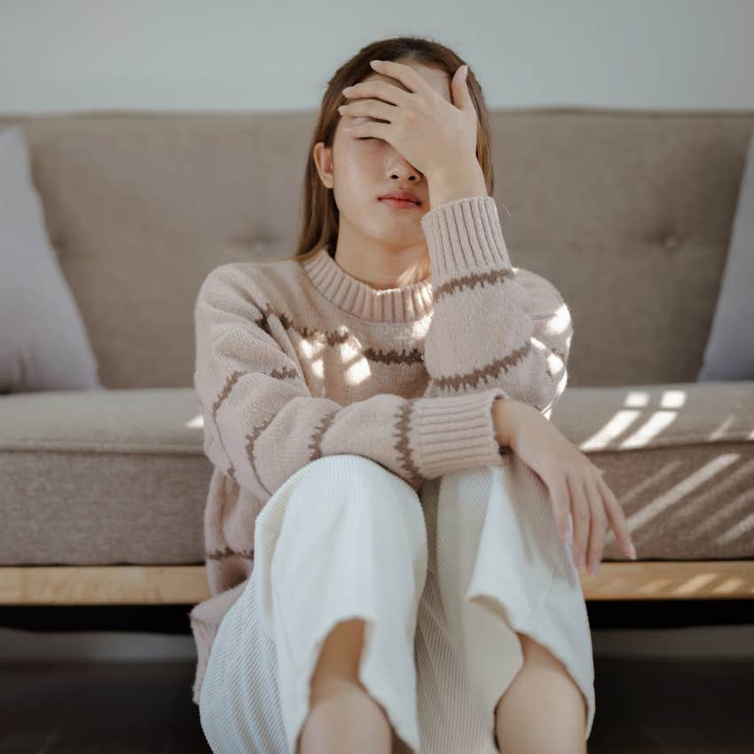 woman who doesn't feel safe in her relationship as she has racing thoughts telling her someone is mad at her
