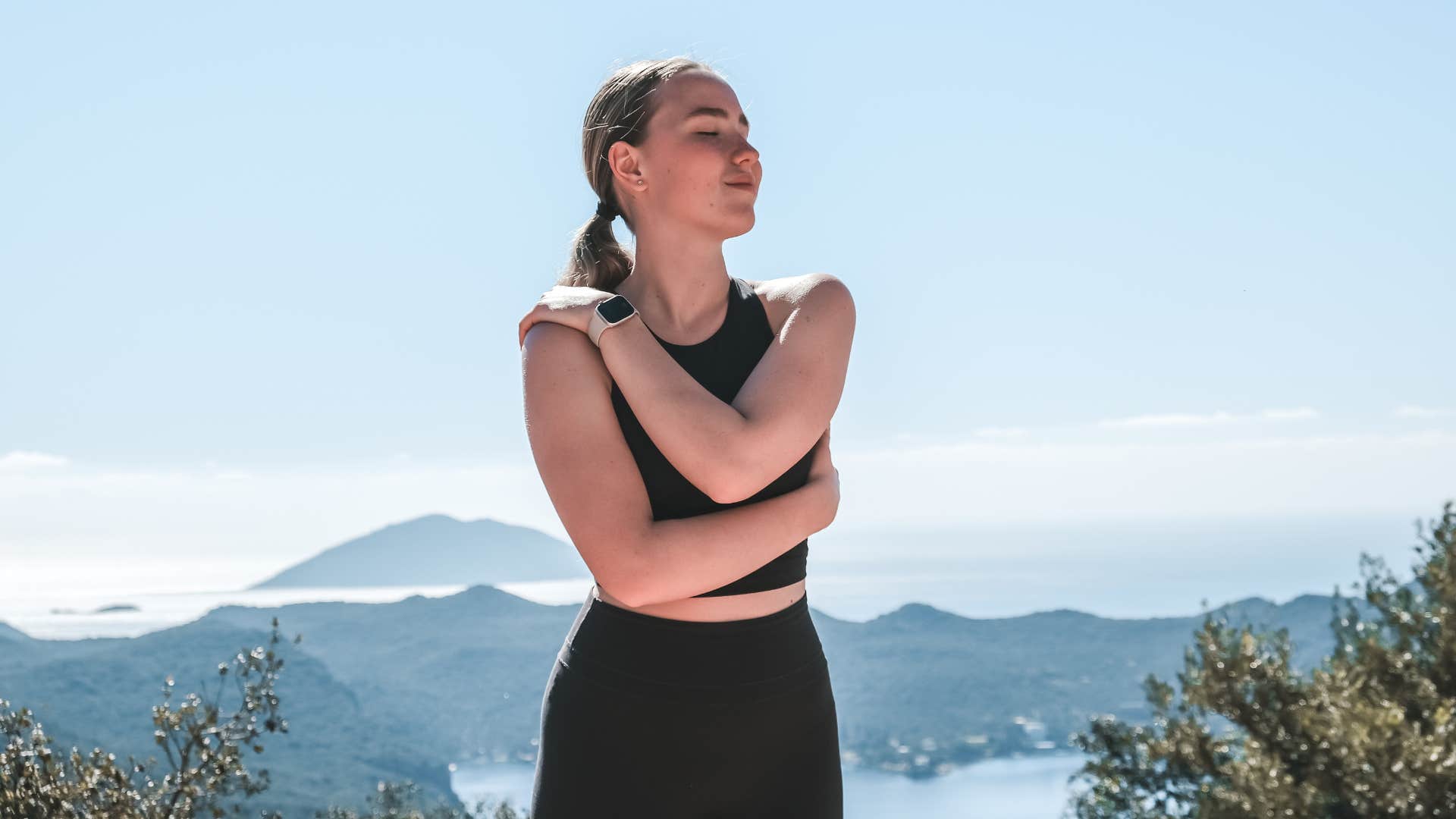 woman on a hike being kind to herself