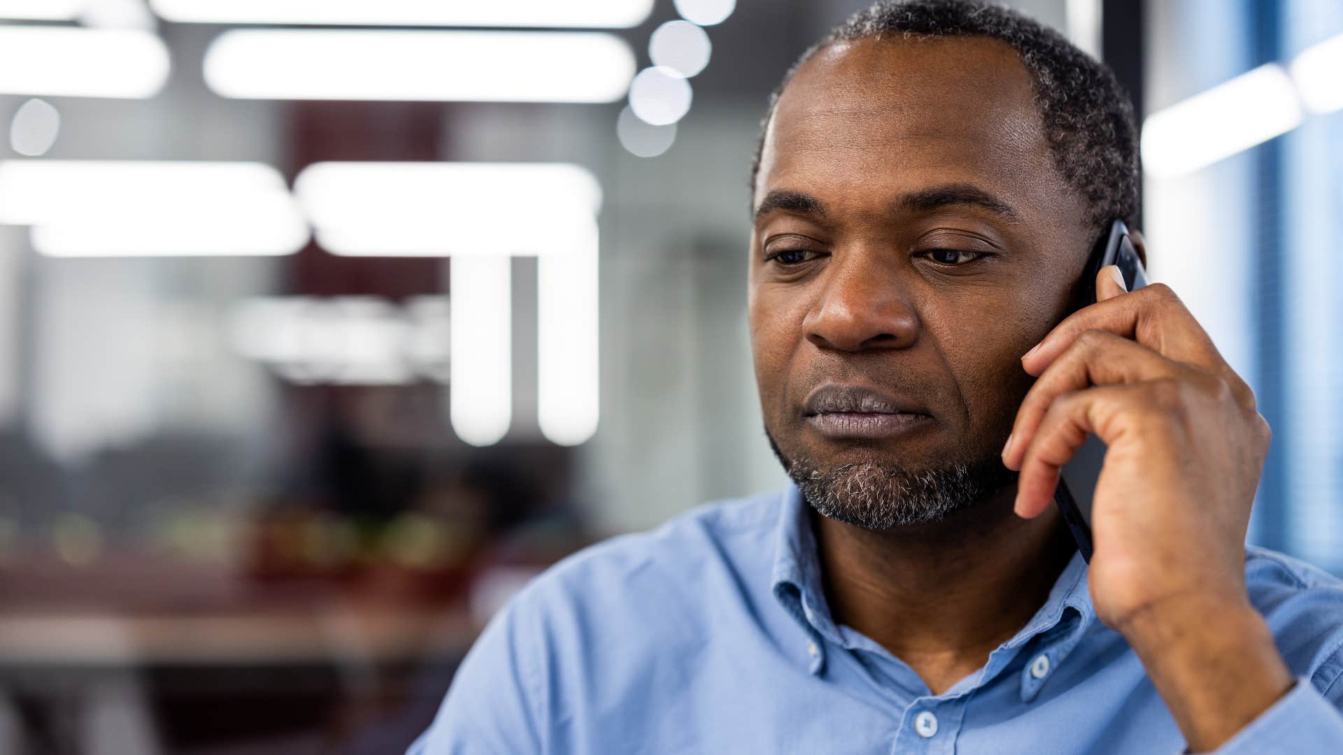 man mentally preparing for phone call