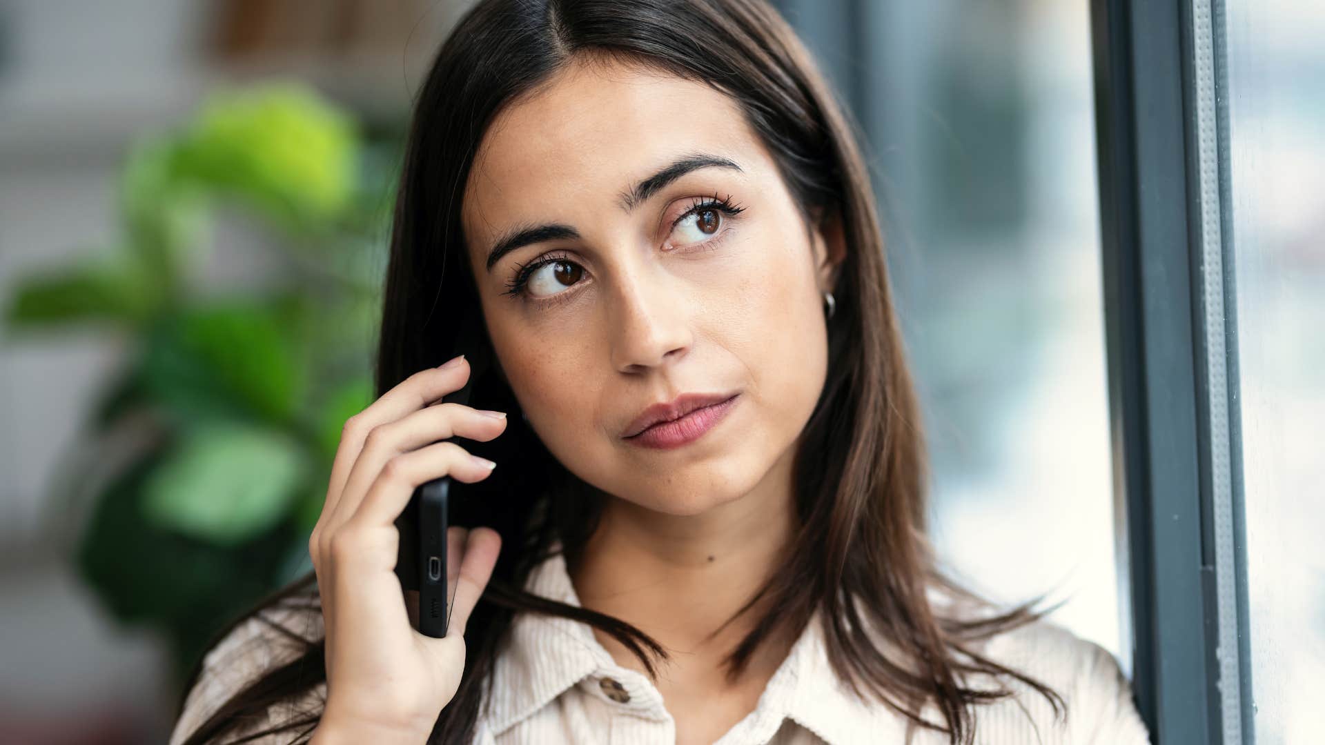 woman who never feels like enough talking on the phone