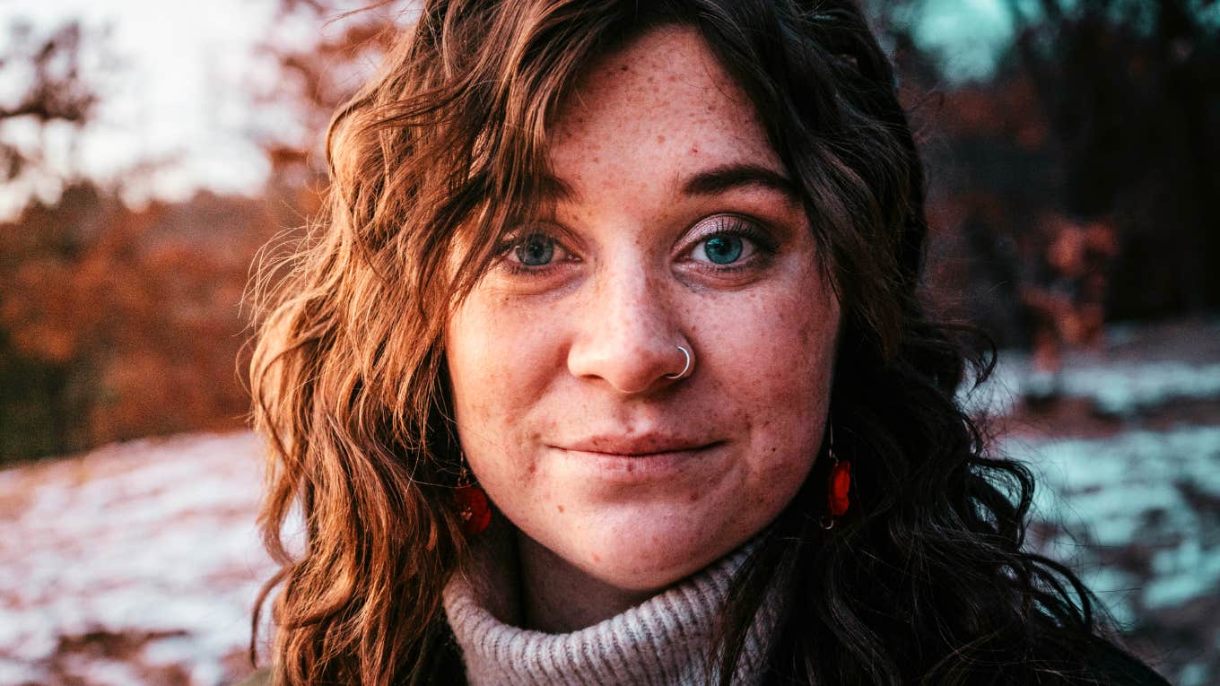 Calm, confident person standing showing how people who ‘get it’ quietly ignore the things society tries to push on them.