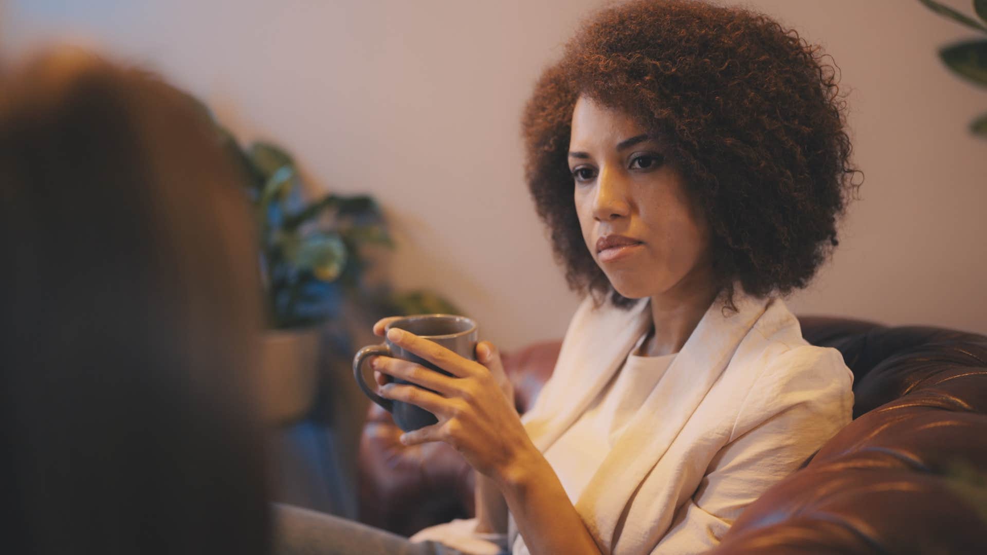 woman feeling misunderstood by friend in conversation
