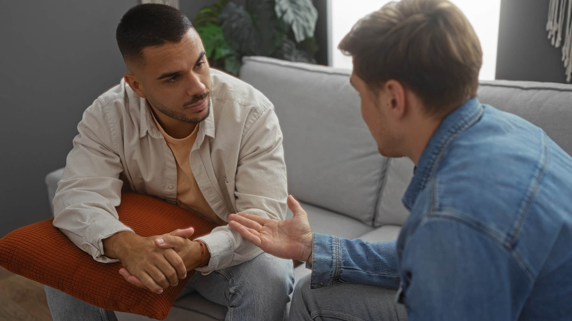 man who knows that not everyone has good interests at heart talking to a friend