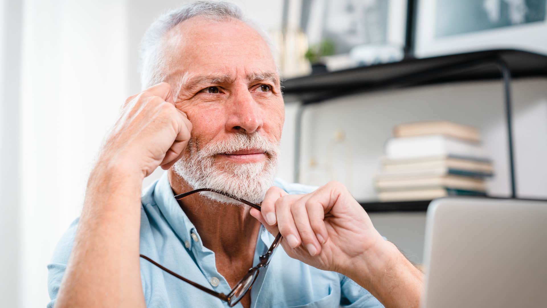 man who's a perfectionist in disguise working on a laptop
