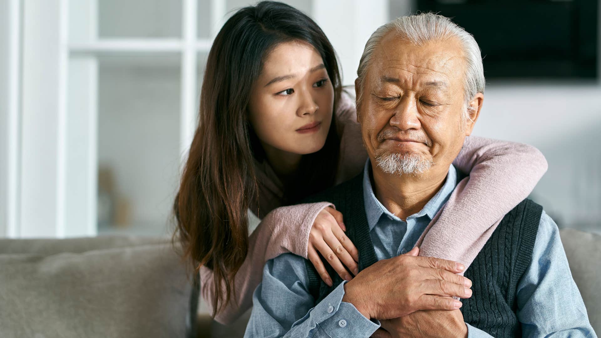 daughter hugging father dealing with grief