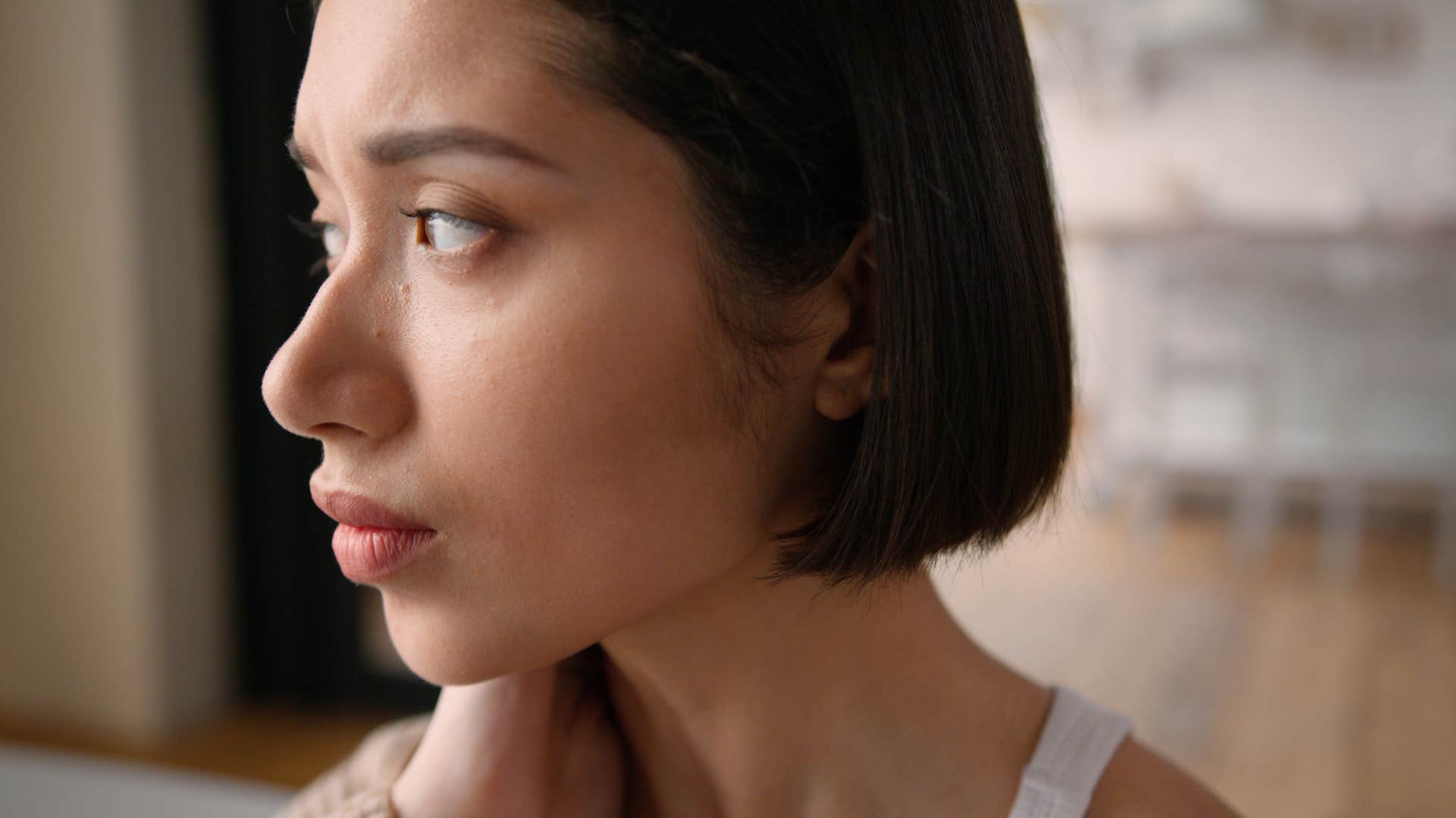 sad upset woman dealing with unresolved childhood trauma