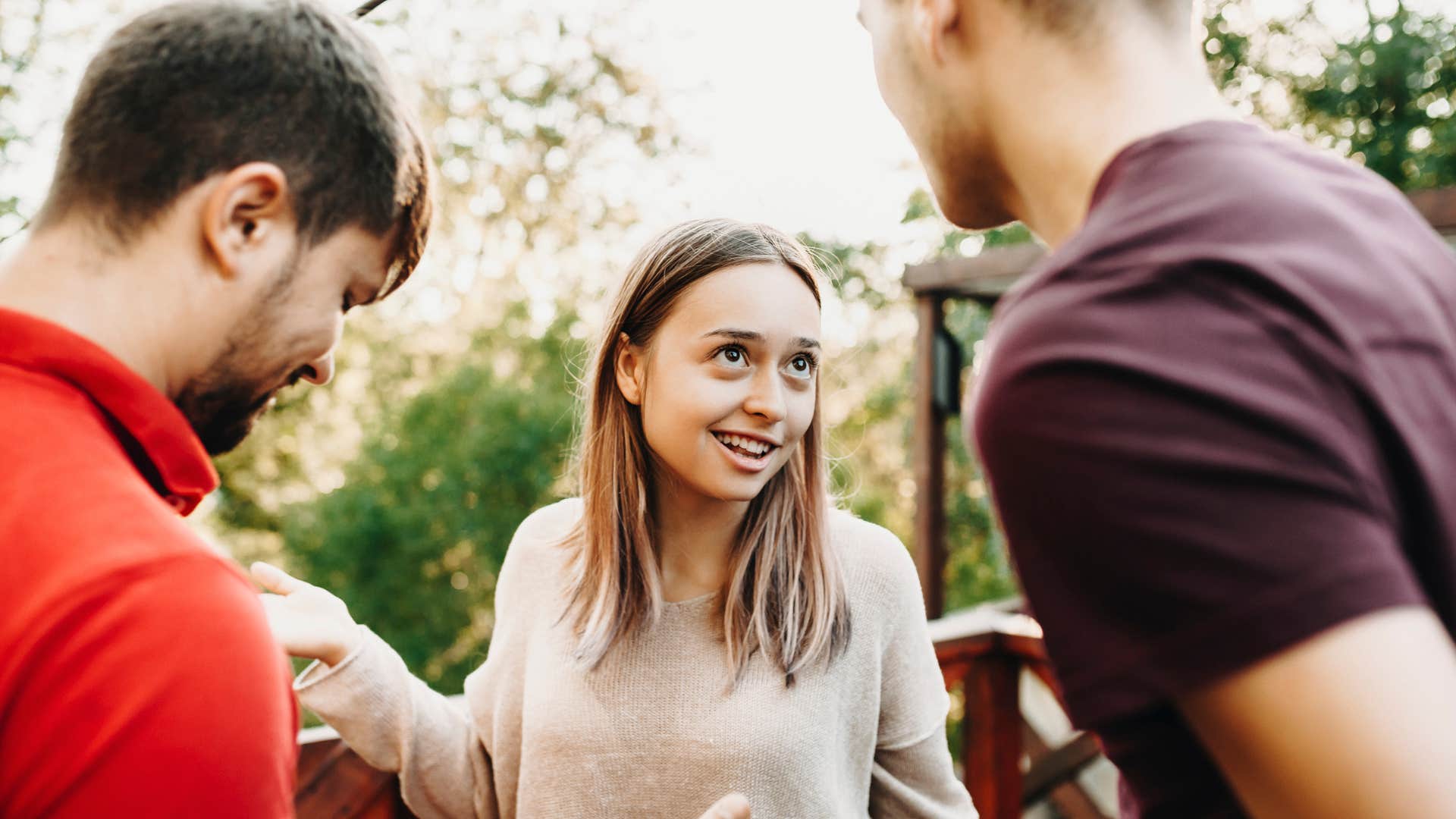 naturally charismatic woman talking to acquaintances