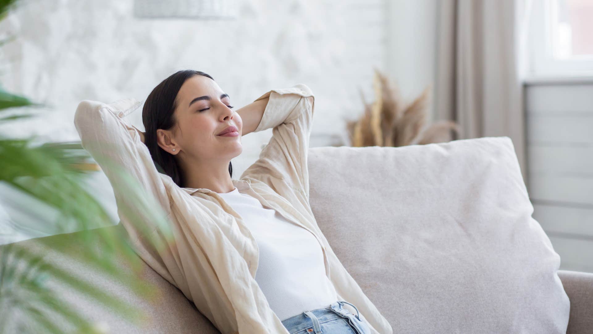 woman relaxing on couch
