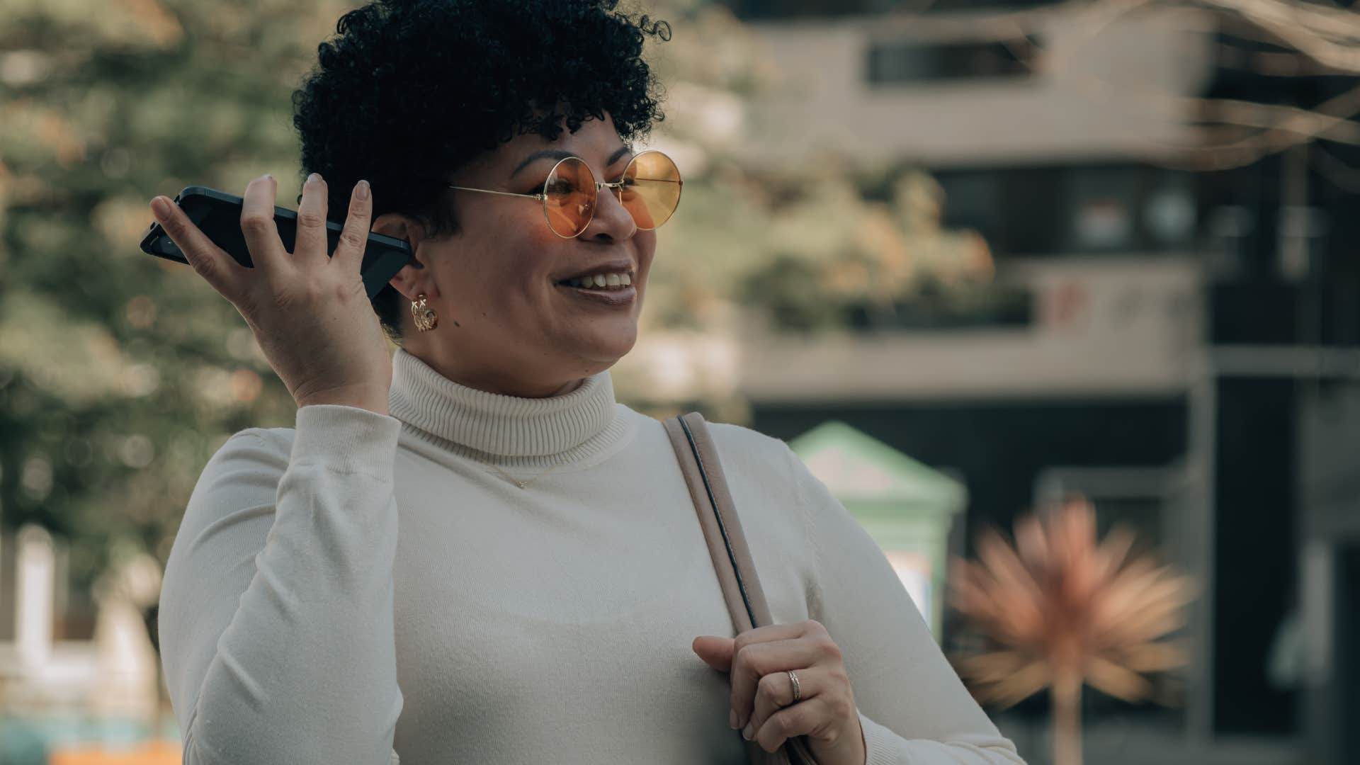 woman listening to message on phone