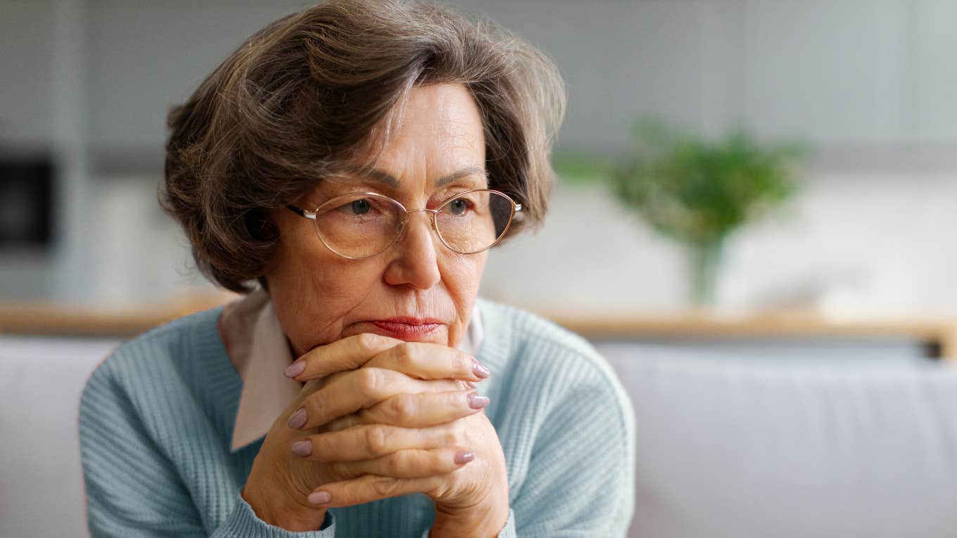 reclusive older woman who rarely goes outside sitting at home