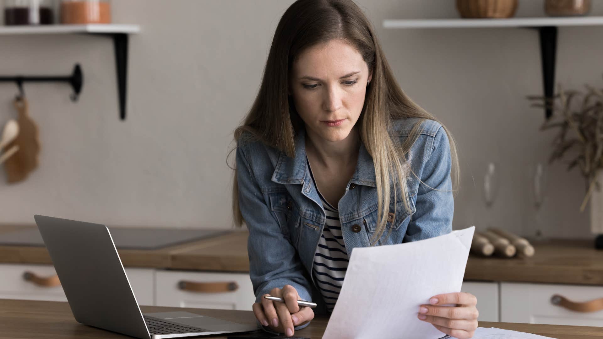 woman who's started saving money in secret doing bills