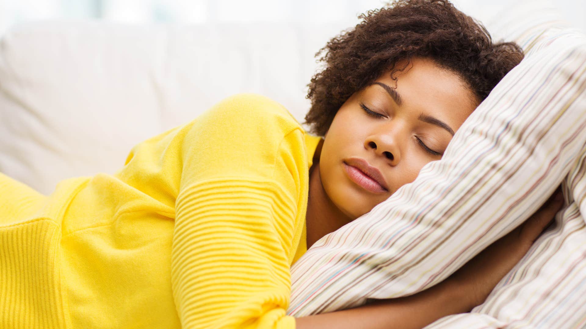 woman who misguidedly craves control asleep on couch