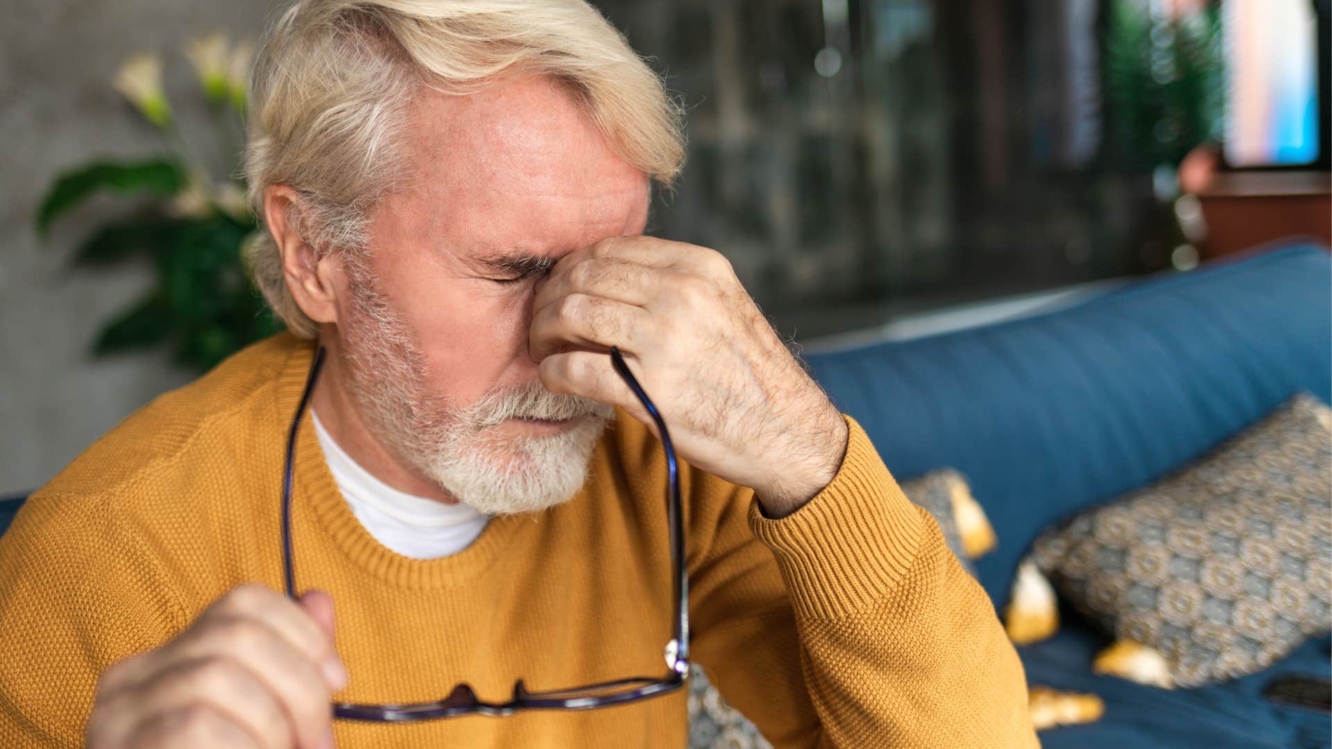 emotionally exhausted man stressing out at home